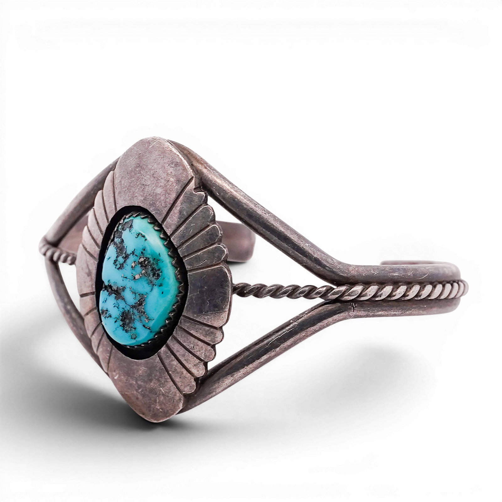 Vintage Steve Dickens Navajo Sterling Silver & Turquoise Cuff Bracelet: Vintage Steve Dickens Navajo Sterling Silver & Turquoise Cuff Bracelet 1970s-1980s, USA Sterling silver cuff centered with an oval turquoise cabochon in a serrated bezel, set on a repoussé and radiat