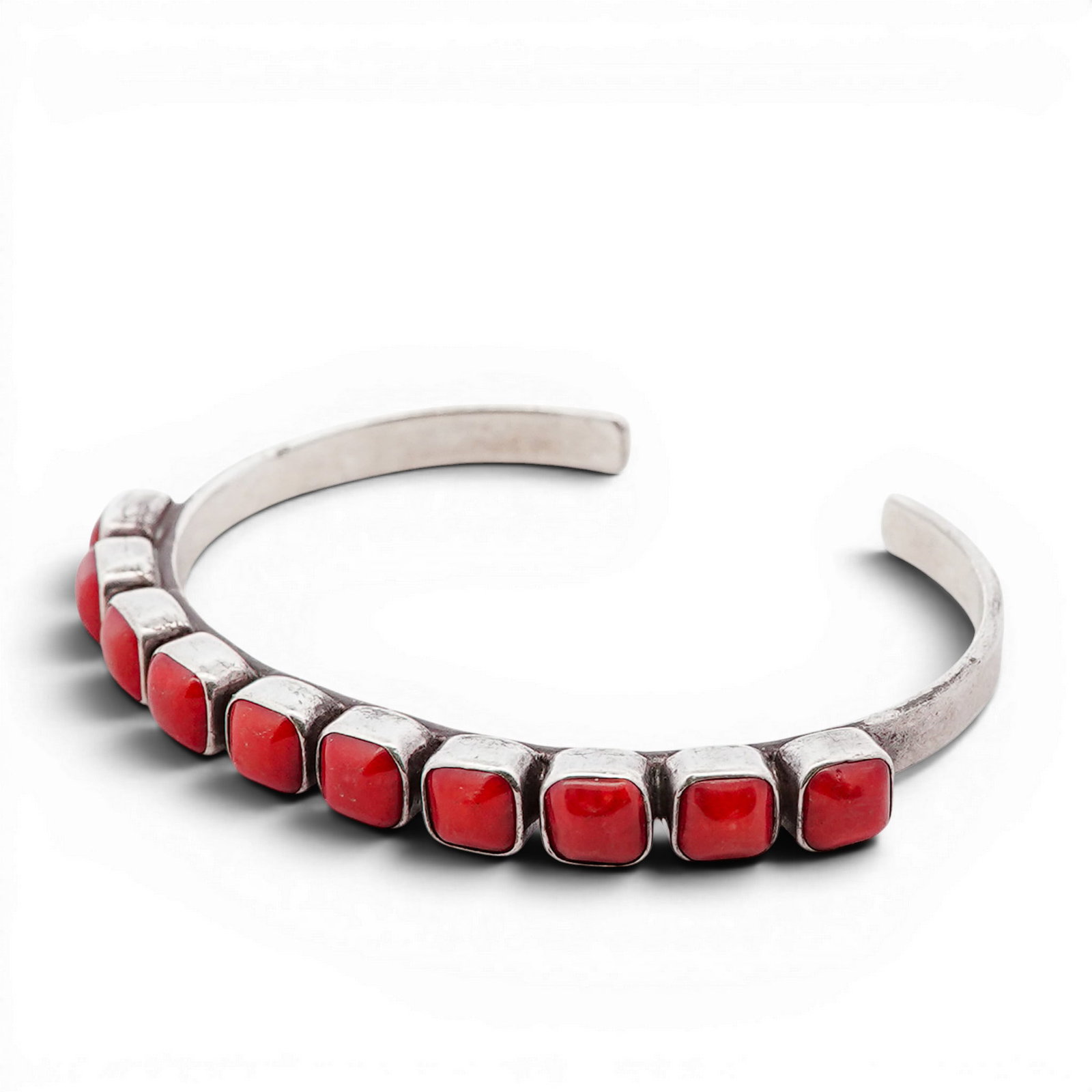 Vintage Navajo Sterling Silver & Coral Row Cuff Bracelet Signed: Vintage Navajo Sterling Silver & Coral Row Cuff Bracelet Signed 1970s-1980s, USA Hand-fabricated cuff bracelet featuring a linear arrangement of rectangular red coral cabochons, each individually beze