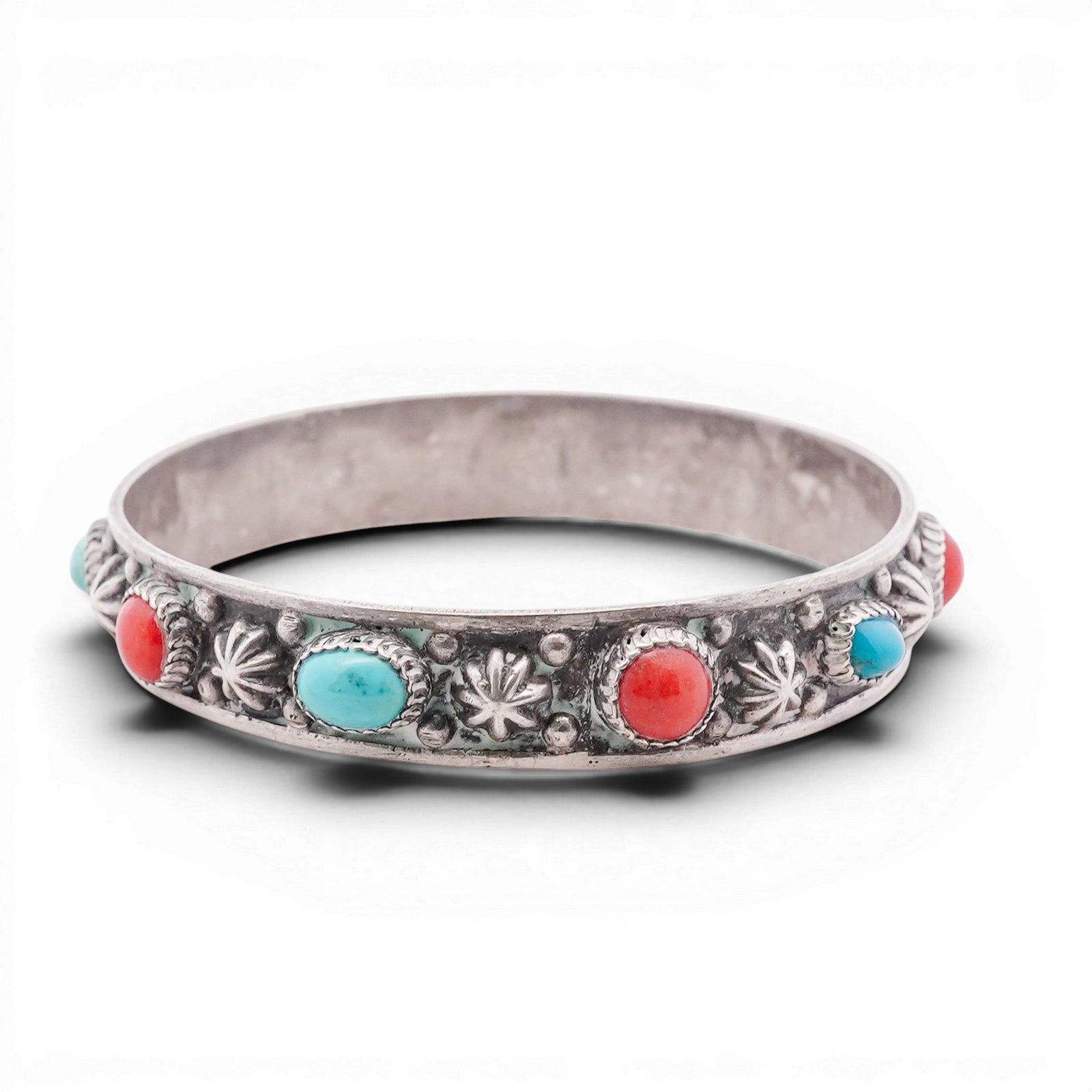 Vintage Navajo Sterling Silver Turquoise & Coral Cuff Bracelet: Vintage Navajo Sterling Silver Turquoise & Coral Cuff Bracelet 1970s-1980s, USA Hand-fabricated cuff bracelet featuring alternating turquoise and red coral cabochons set in serrated bezels across a wi