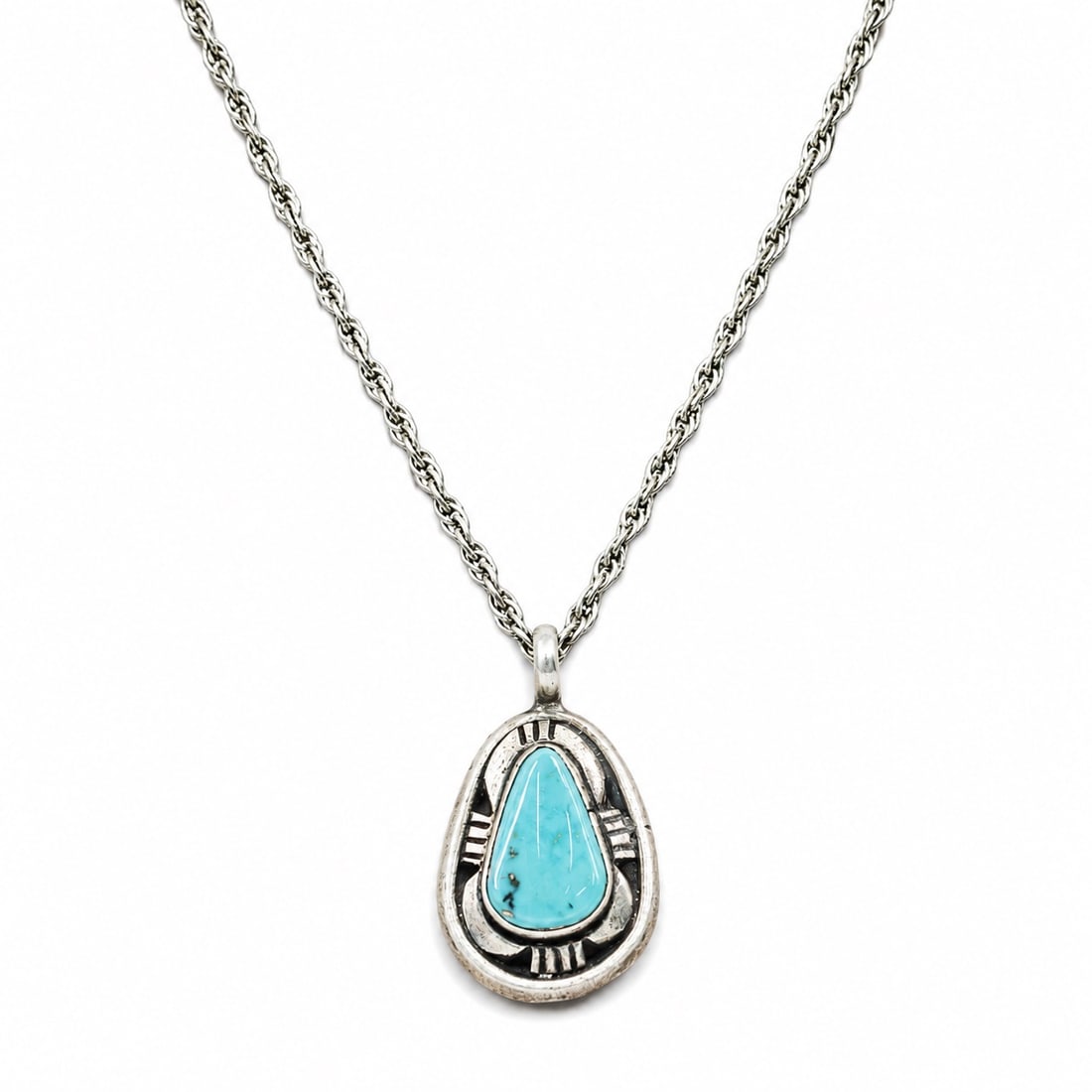 Rose Begay Navajo Sterling Silver & Turquoise Pendant Necklace: Rose Begay Navajo Sterling Silver & Turquoise Pendant Necklace 1980s-1990s, Navajo Navajo sterling silver pendant necklace by Rose Begay featuring a bezel-set turquoise cabochon in an openwork shadowb