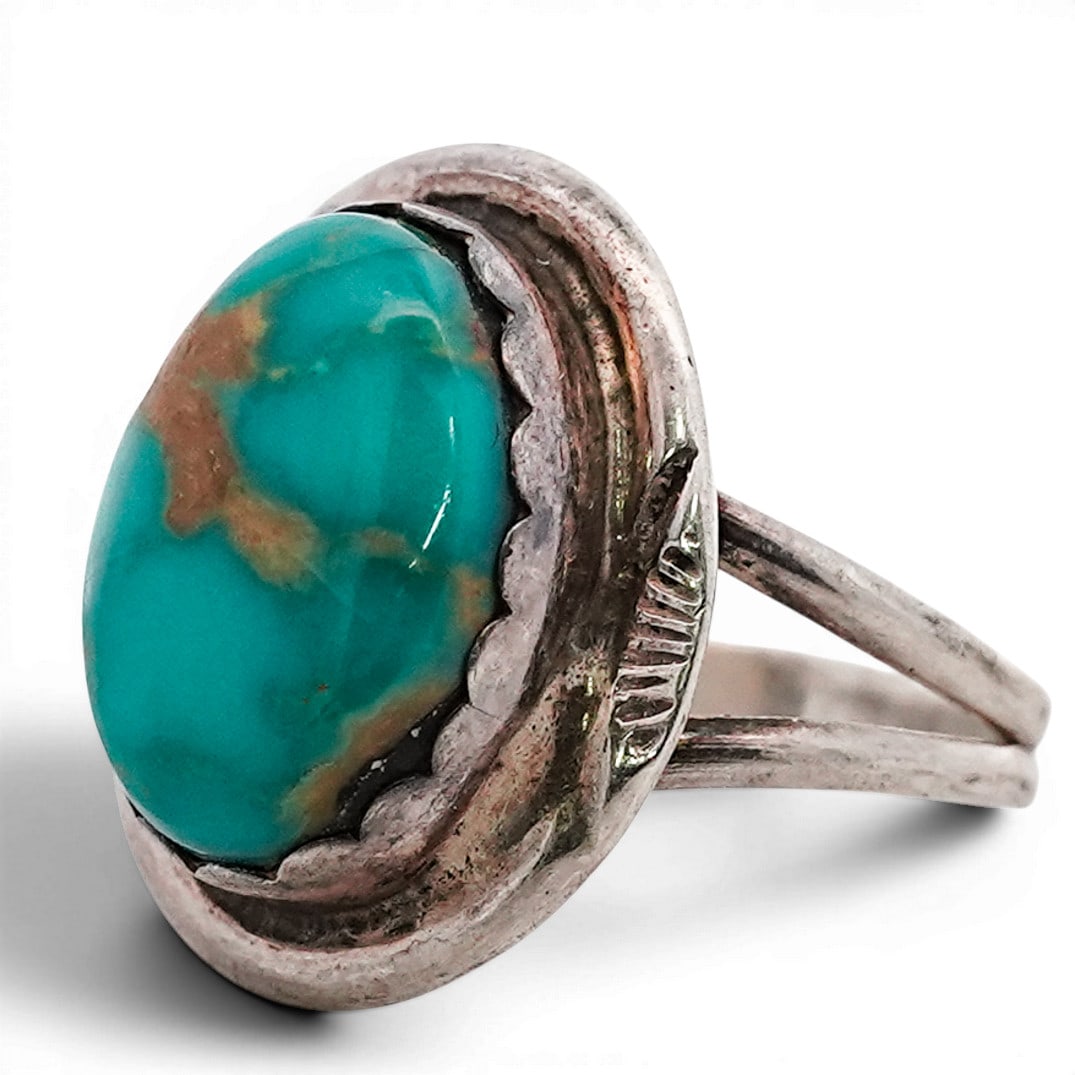 Vintage Navajo Sterling Silver & Turquoise Ring Signed: Vintage Navajo Sterling Silver & Turquoise Ring Signed 1970s-1980s, USA Sterling silver ring set with an oval turquoise cabochon displaying natural tan matrix. Stone set in a serrated bezel over a rou