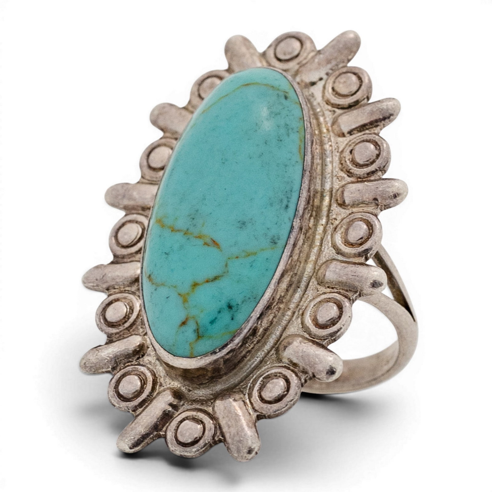 Vintage Mexican Sterling Silver & Oval Turquoise Ring: Vintage Mexican Sterling Silver & Oval Turquoise Ring 1970s-1980s, USA Vintage Mexican elongated oval turquoise cabochon with light natural matrix set in a smooth bezel, framed by a radiating repouss�