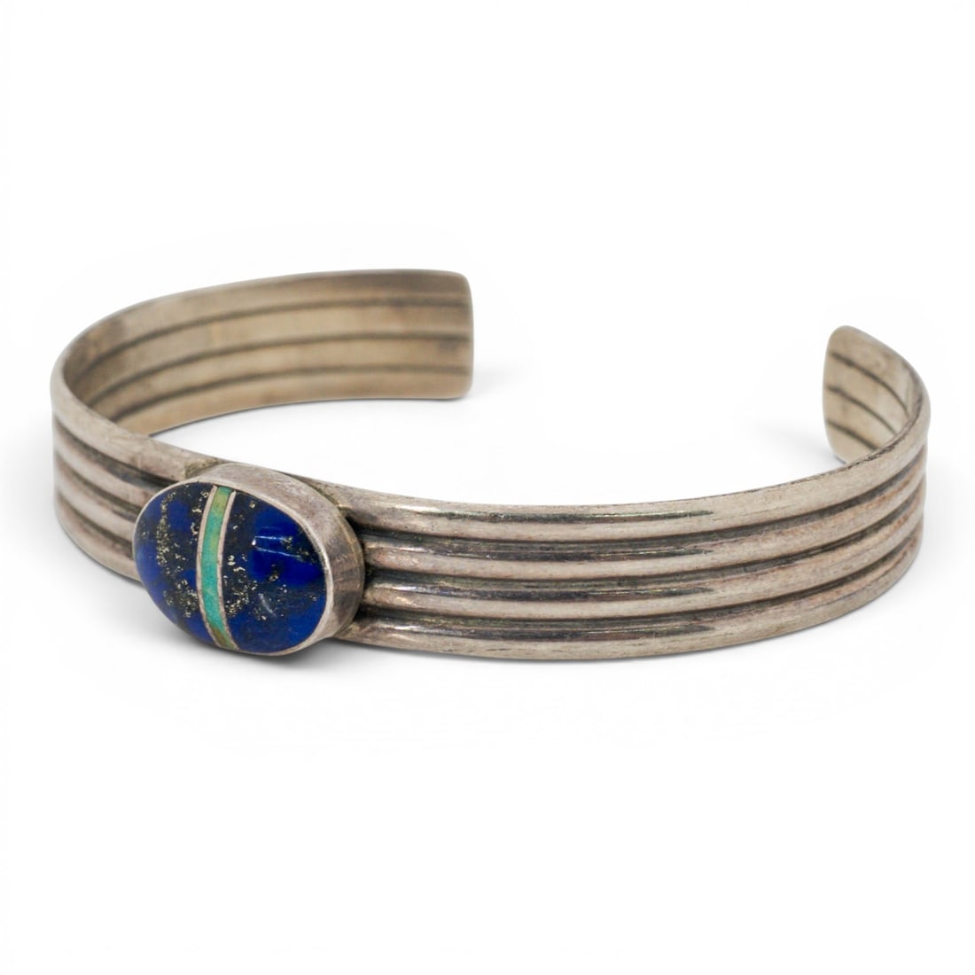 Vintage Navajo Sterling Silver Lapis & Turquoise Inlay Cuff Bracelet Signed: Vintage Navajo Sterling Silver Lapis & Turquoise Inlay Cuff Bracelet Signed 1970s-1980s, USA Vintage Navajo sterling silver cuff bracelet featuring a ribbed triple-band shank centered by an oval inlay