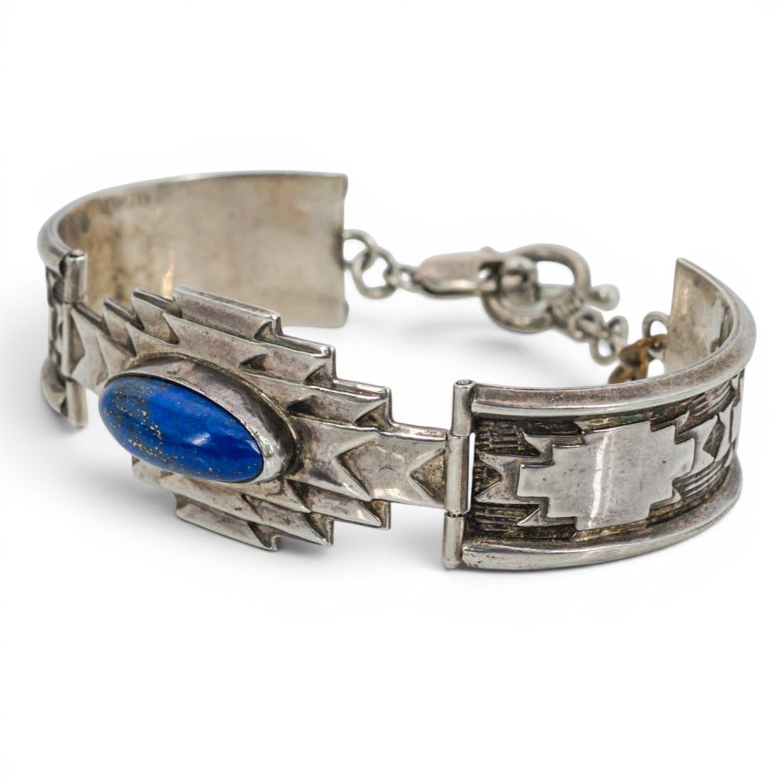 Vintage Mark Jimenez Navajo Sterling Silver & Lapis Cuff Bracelet: Vintage Mark Jimenez Navajo Sterling Silver & Lapis Cuff Bracelet 1970s-1980s, USA Vintage Navajo sterling silver hinged cuff bracelet centered with an oval lapis lazuli cabochon in a stepped geometri