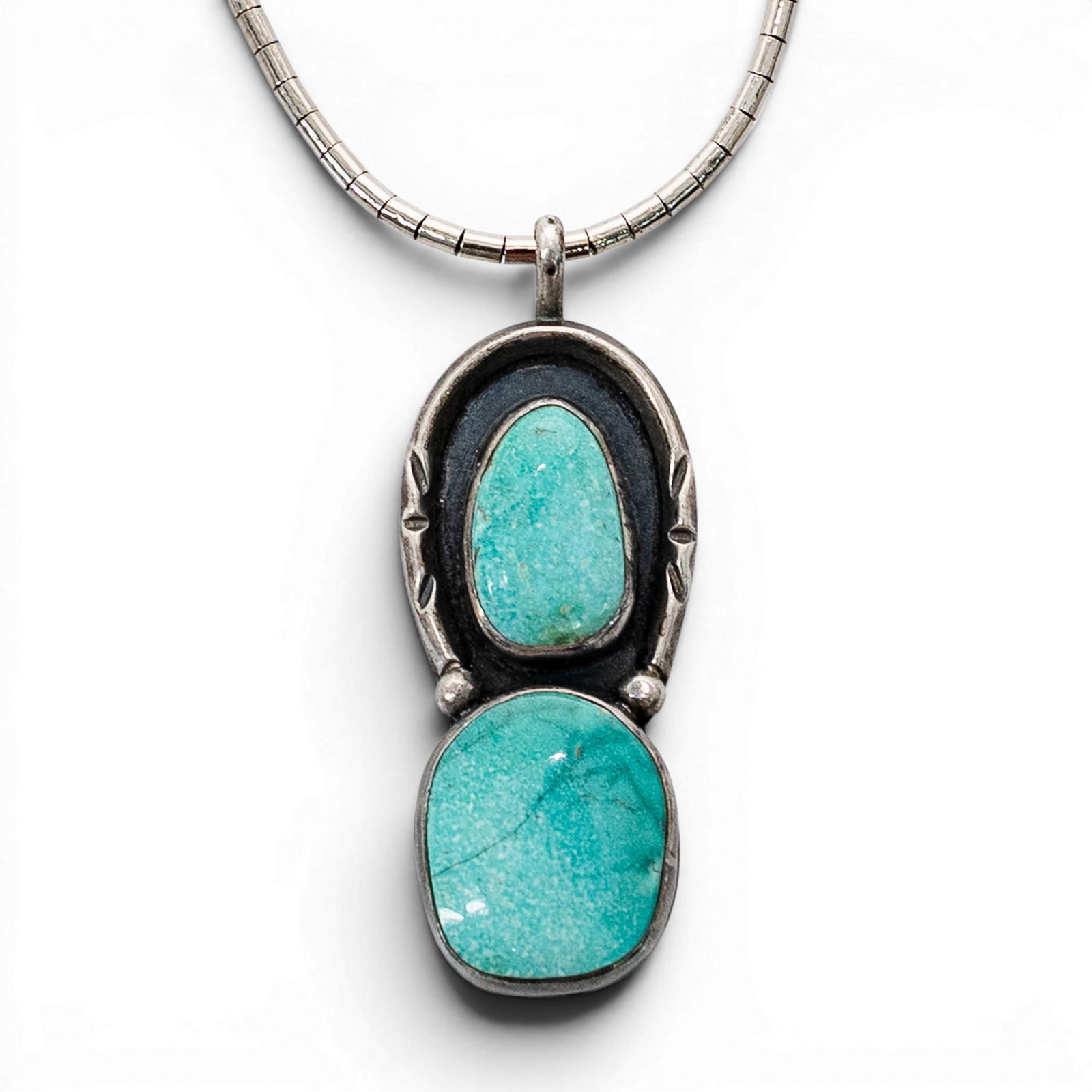 Vintage Navajo Sterling Silver & Turquoise Pendant Necklace: Vintage Navajo Sterling Silver & Turquoise Pendant Necklace 1970s-1980s, USA Vintage Navajo sterling silver necklace with segmented snake-style chain and pendant set with two turquoise cabochons in pl
