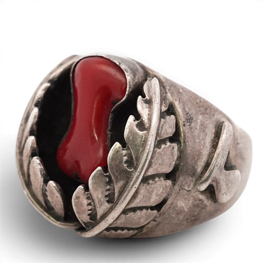 Vintage Navajo Sterling Silver & Coral Leaf Ring: Vintage Navajo Sterling Silver & Coral Leaf Ring 1970s-1980s, USA Vintage Navajo sterling silver ring set with a carved branch-form red coral cabochon within a scalloped bezel. The top is framed by ap