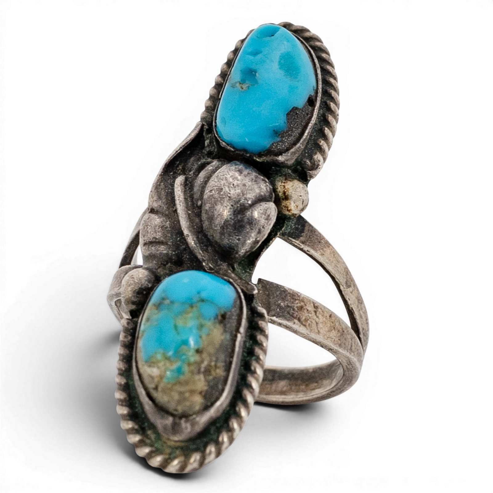 Vintage Navajo Sterling Silver & Double Turquoise Ring: Vintage Navajo Sterling Silver & Double Turquoise Ring 1970s-1980s, USA Vertical double-stone ring set with two oval turquoise cabochons displaying natural matrix, each in a serrated bezel with twiste