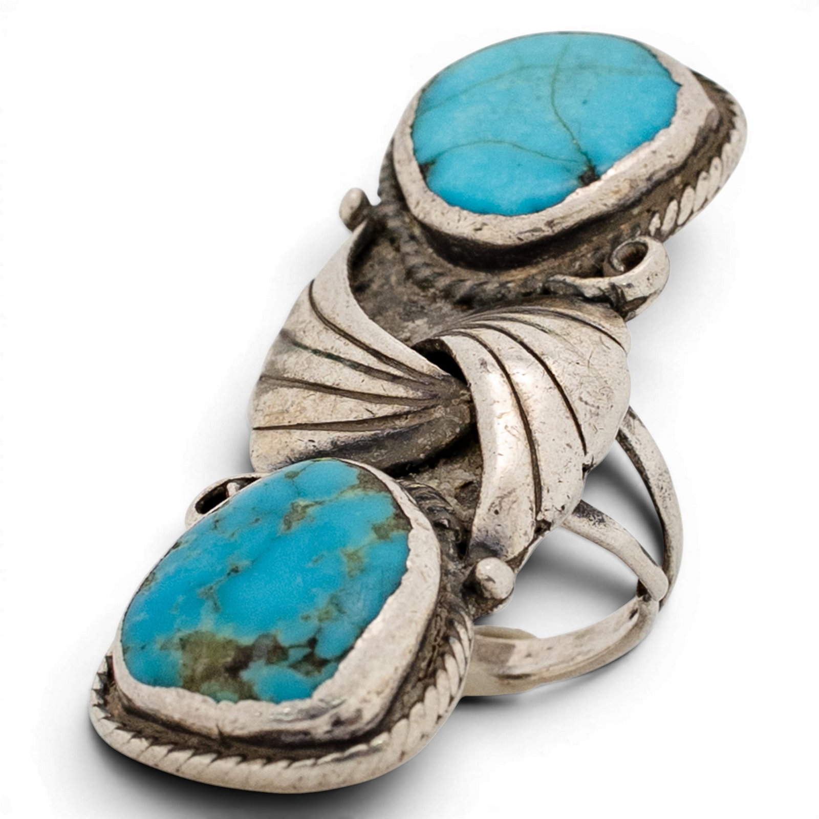 Vintage Navajo Sterling Silver & Double Turquoise Leaf Motif Ring: Vintage Navajo Sterling Silver & Double Turquoise Leaf Motif Ring 1970s-1980s, USA Vintage Navajo double-stone ring set with two oval turquoise cabochons exhibiting natural matrix, each in a serrated 