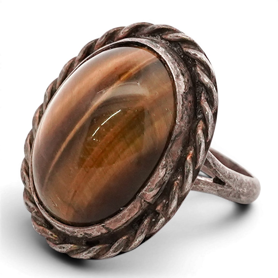 Vintage Navajo Sterling Silver Tiger’s Eye Ring, Marked: Vintage Navajo Sterling Silver Tiger’s Eye Ring, Marked Vintage sterling silver ring featuring a large oval cabochon stone with warm brown and amber-toned banding, likely agate or tiger’s eye. The