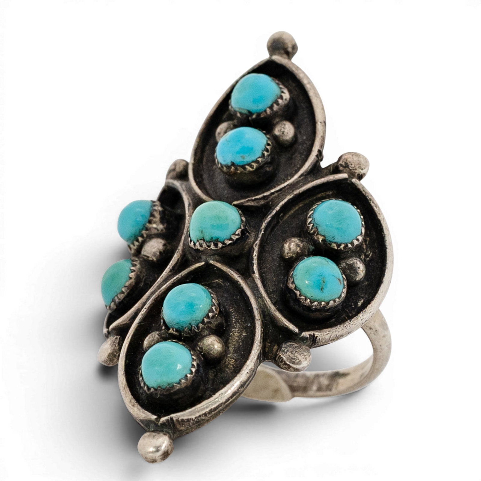 Vintage Zuni Sterling Silver & Turquoise Cluster Ring: Vintage Zuni Sterling Silver & Turquoise Cluster Ring 1970s-1980s, USA Multi-panel cluster ring composed of four navette-shaped settings, each centered with paired turquoise cabochons in serrated beze