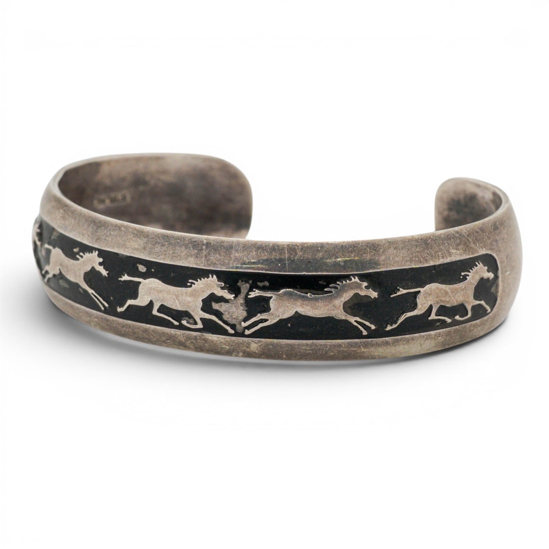 Vintage B. Webb Sterling Silver Horse Overlay Cuff Bracelet: Vintage B. Webb Sterling Silver Horse Overlay Cuff Bracelet 1970s-1980s, USA Vintage sterling silver cuff bracelet by B. Webb featuring a continuous overlay of running horses against a dark oxidized g