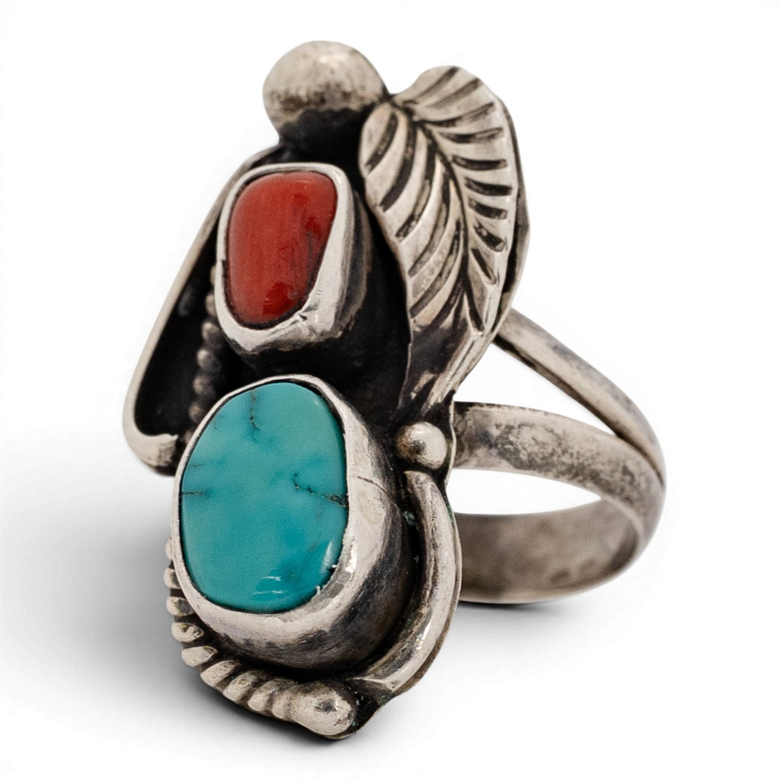 Vintage Navajo Sterling Silver Turquoise & Coral Leaf Ring: Vintage Navajo Sterling Silver Turquoise & Coral Leaf Ring 1970s-1980s, USA Sterling silver ring featuring an oval turquoise cabochon and a smaller coral cabochon in a vertical arrangement. The stones