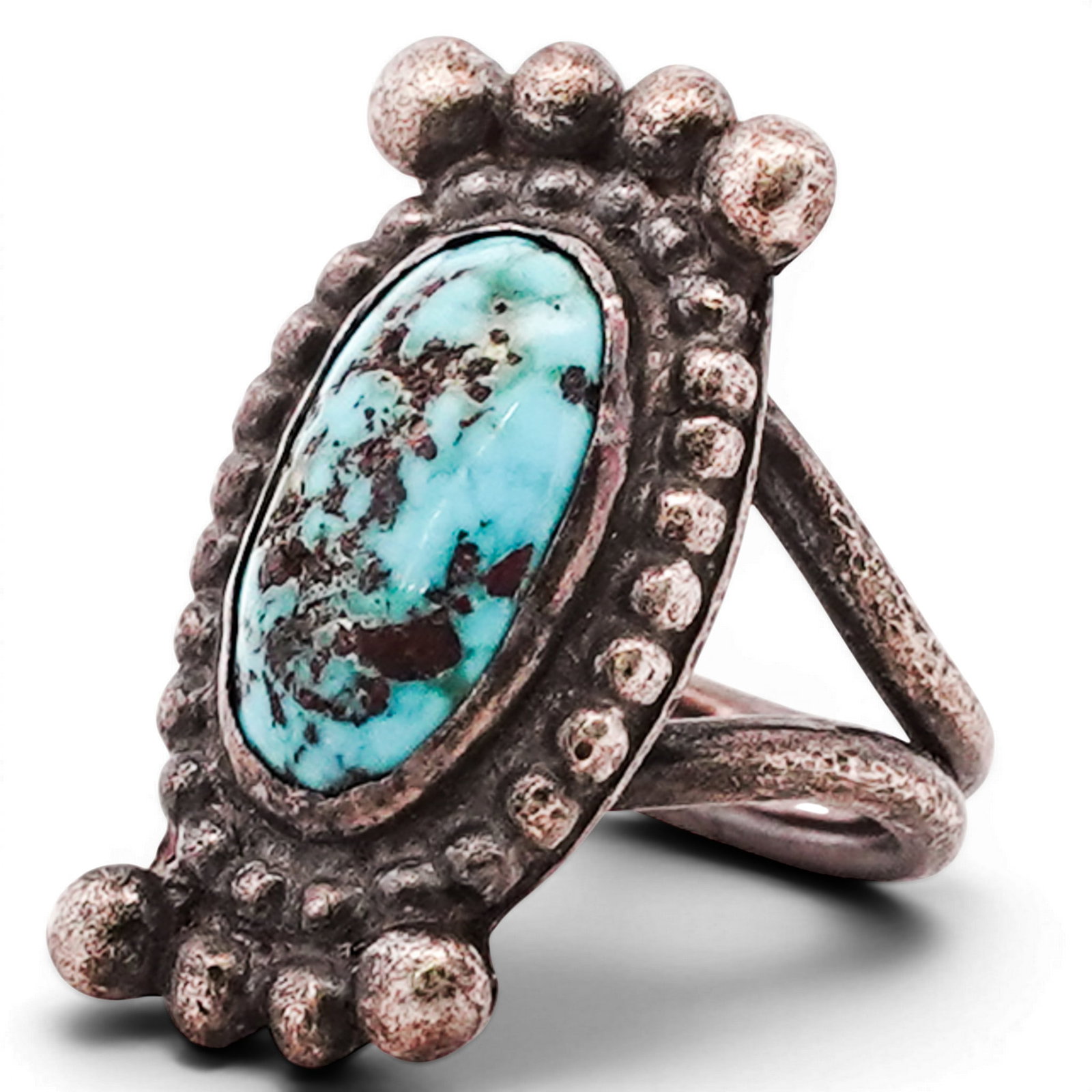 Vintage Navajo Sterling Silver & Turquoise Ring Signed: Vintage Navajo Sterling Silver & Turquoise Ring Signed 1970s–1980s, USA Sterling silver ring set with an oval turquoise cabochon exhibiting natural matrix within a serrated bezel, surrounded by appl