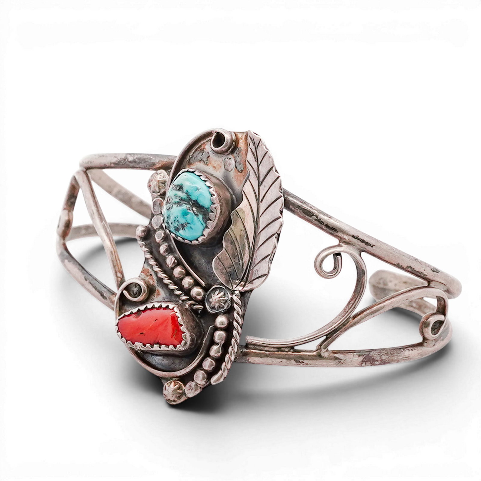Vintage Navajo Sterling Silver Turquoise & Coral Cluster Floral Cuff: Vintage Navajo Sterling Silver Turquoise & Coral Cluster Floral Cuff 1970s-1980s, USA Openwork sterling silver cuff bracelet set with a round cabochon turquoise and triangular cabochon red coral, each