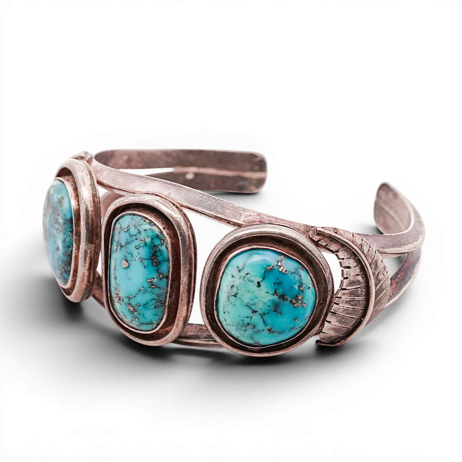 Vintage Navajo Sterling Silver & Turquoise Cuff Bracelet: Vintage Navajo Sterling Silver & Turquoise Cuff Bracelet 1970s-1980s, USA Hand-fabricated cuff bracelet set with three oval turquoise cabochons, each in a plain bezel with stepped silver surrounds. Th