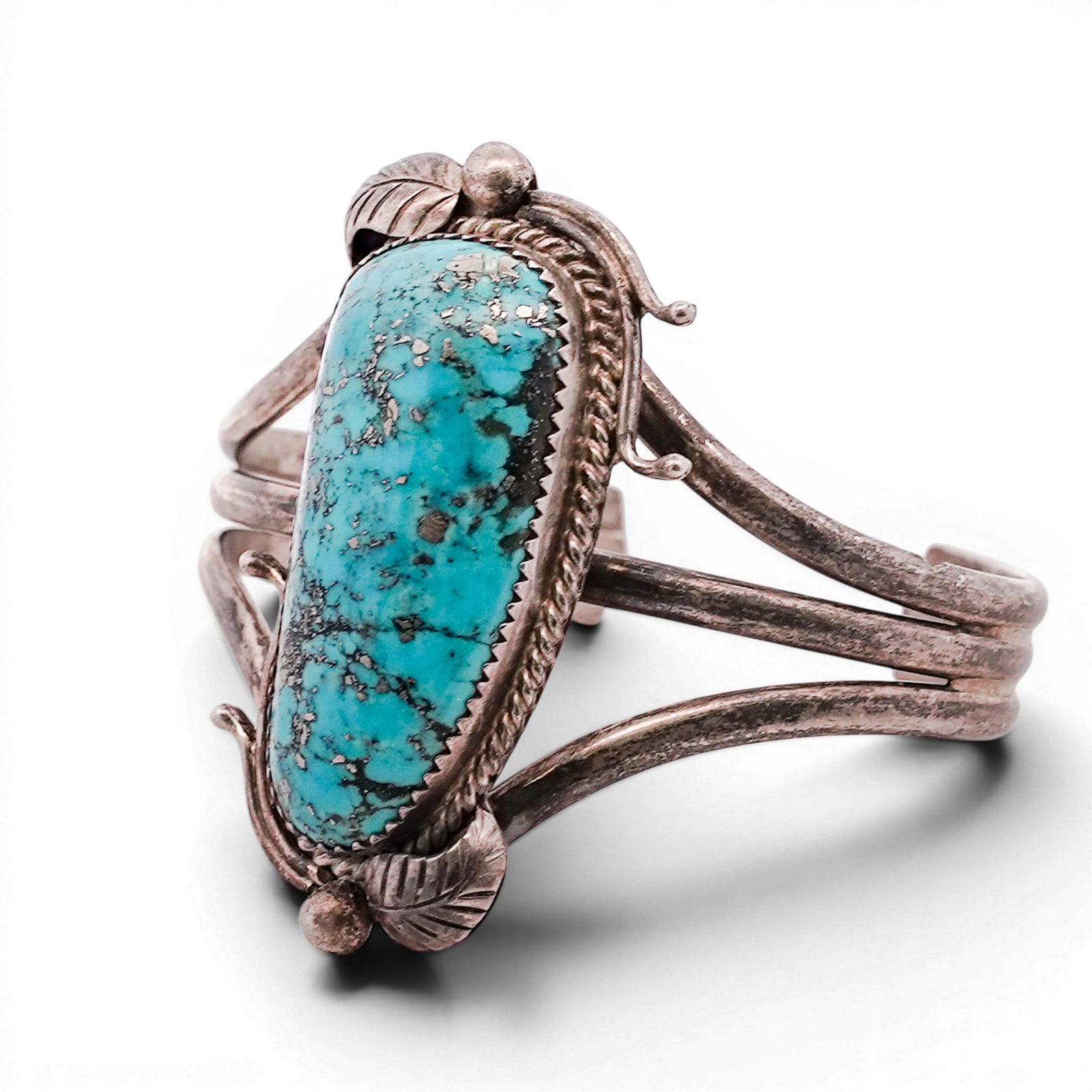 Vintage Navajo Sterling Silver & Turquoise Cuff Bracelet: Vintage Navajo Sterling Silver & Turquoise Cuff Bracelet 1970s-1980s, USA Navajo cuff bracelet set with a large elongated oval turquoise cabochon measuring approximately 38 × 14 mm, displaying blue-g