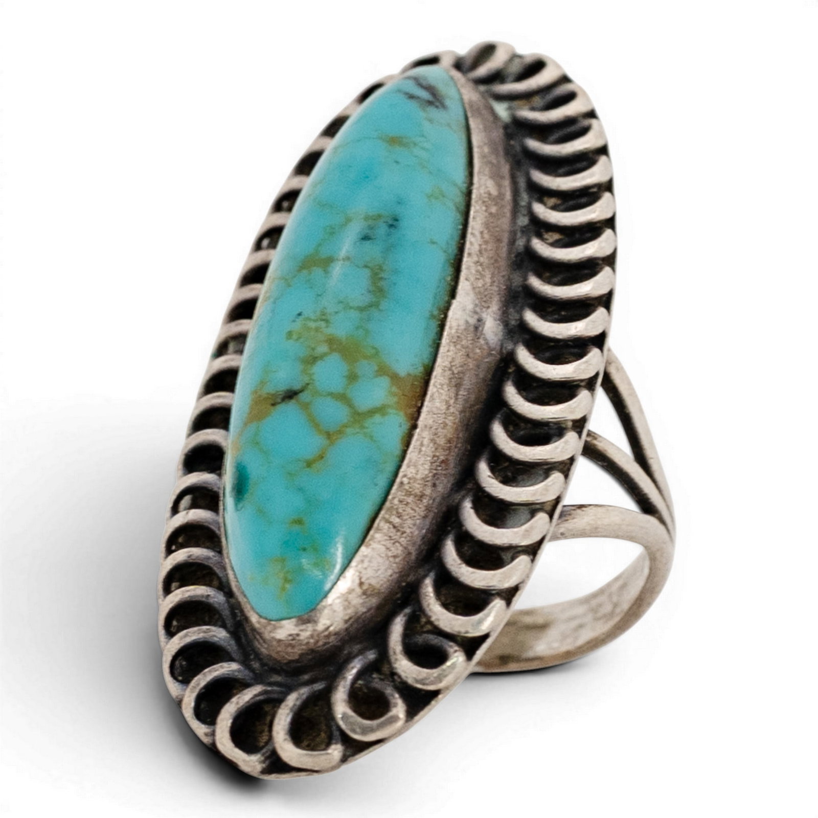 Vintage Navajo Sterling Silver & Turquoise Cluster Ring: Vintage Navajo Sterling Silver & Turquoise Cluster Ring 1970s-1980s, USA Elongated navette turquoise cabochon with light matrix set in a serrated bezel, surrounded by a scalloped shadowbox border comp