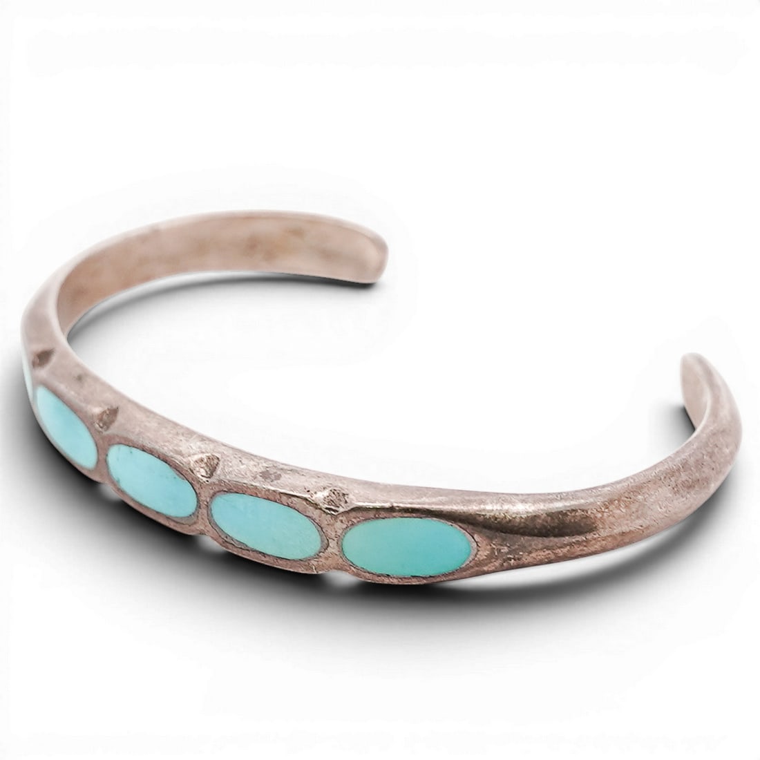 Vintage Navajo Sterling Silver & Turquoise Inlay Cuff Bracelet: Vintage Navajo Sterling Silver & Turquoise Inlay Cuff Bracelet 1970s-1980s, USA Vintage Navajo sterling silver cuff bracelet set with a row of oval turquoise cabochons in a linear arrangement. Interio