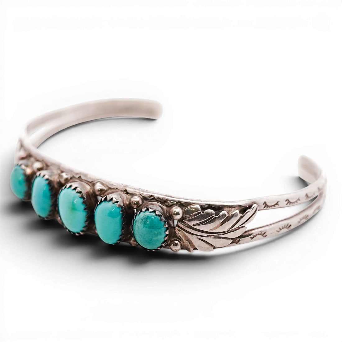 Vintage Navajo Sterling Silver & Turquoise Cuff Bracelet Signed: Vintage Navajo Sterling Silver & Turquoise Cuff Bracelet Signed 1970s-1980s, USA Vintage Navajo sterling silver cuff set with an oval turquoise cabochon in a rope-twist bezel, flanked by applied conch