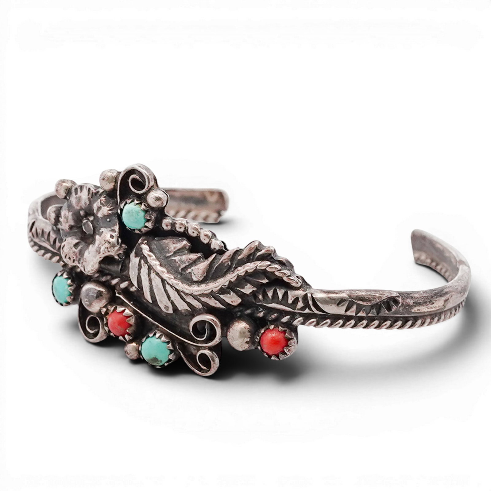 Vintage Navajo Sterling Silver Turquoise & Coral Floral Cuff Bracelet: Vintage Navajo Sterling Silver Turquoise & Coral Floral Cuff Bracelet 1970s-1980s, USA Hand-fabricated cuff bracelet with a central applied floral element, accented by scrolling wirework, bead accents