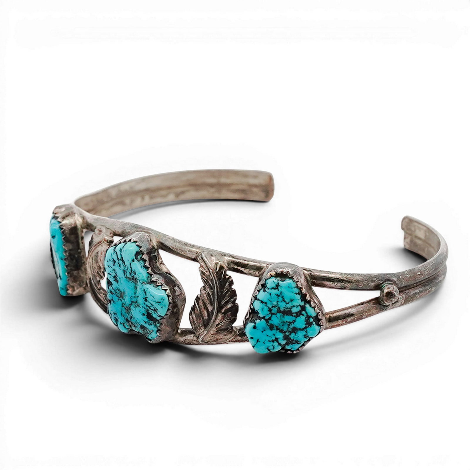 Vintage Navajo Sterling Silver & Turquoise Cuff Bracelet: Vintage Navajo Sterling Silver & Turquoise Cuff Bracelet 1970s-1980s, USA Hand-fabricated cuff bracelet set with three irregular turquoise cabochons, including a central nugget-form stone flanked by t