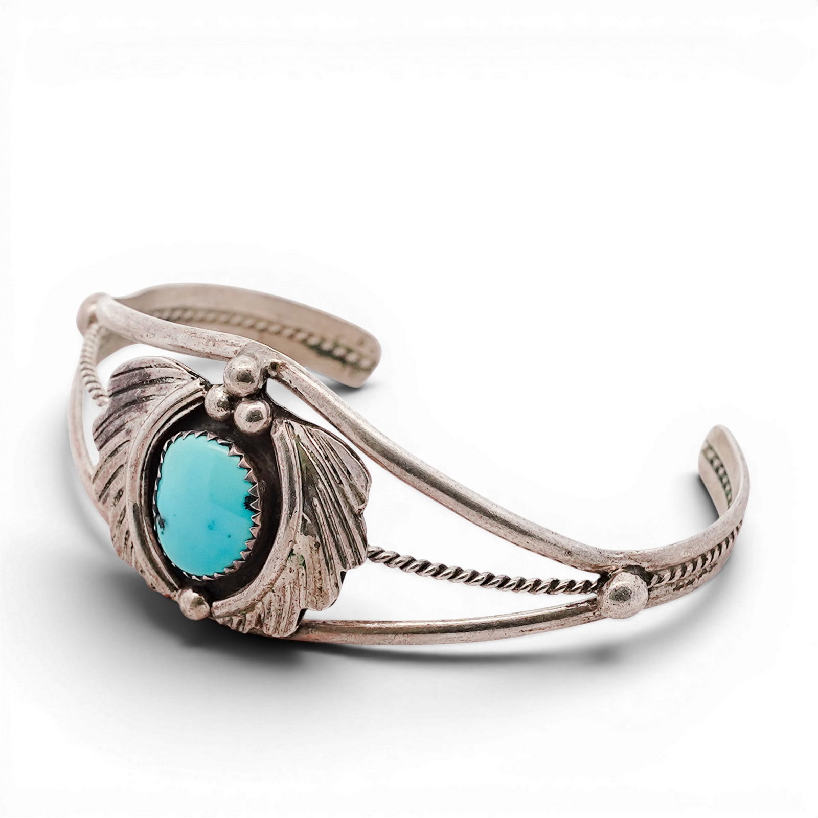 Vintage Navajo Sterling Silver & Turquoise Cuff Bracelet Signed: Vintage Navajo Sterling Silver & Turquoise Cuff Bracelet Signed 1970s-1980s, USA Hand-fabricated cuff bracelet with a central oval cabochon turquoise set in a serrated bezel. The stone is framed by re