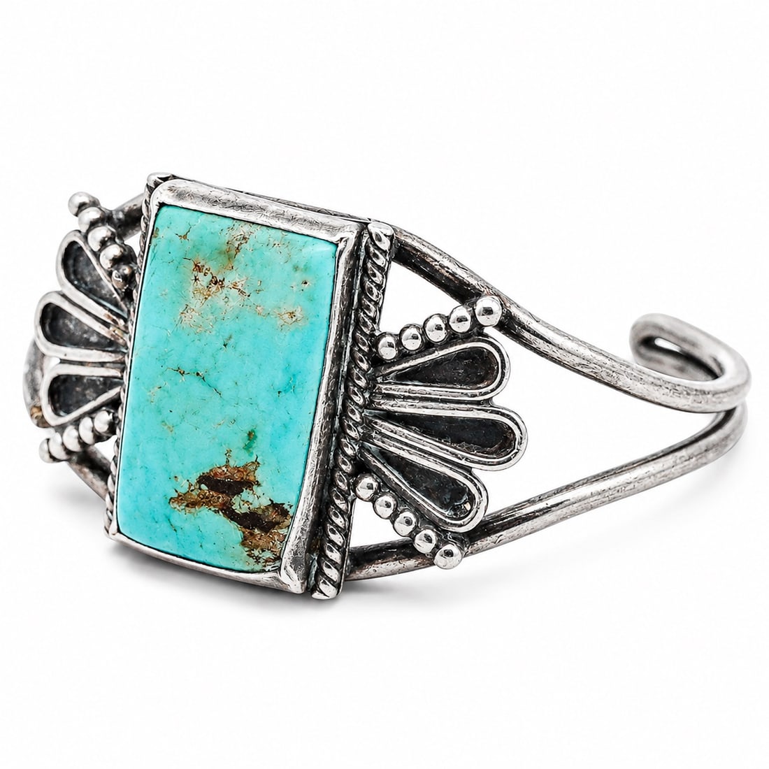 Vintage Navajo Sterling Silver & Turquoise Cuff Bracelet: Vintage Navajo Sterling Silver & Turquoise Cuff Bracelet 1970s-1980s, USA Sterling silver cuff set with a rectangular turquoise cabochon in serrated bezel, framed by twisted wire border and flanked by