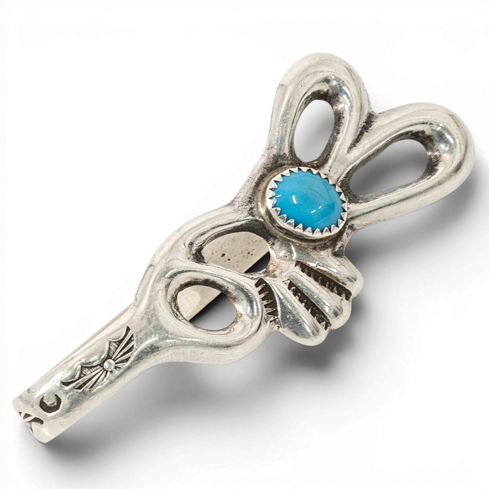 Navajo Sterling Silver & Turquoise Money Clip: Navajo Sterling Silver & Turquoise Money Clip 1980s-1990s, USA Navajo sterling silver money clip with openwork feather-form design, stamped accents, and an oval turquoise cabochon set in a sawtooth be