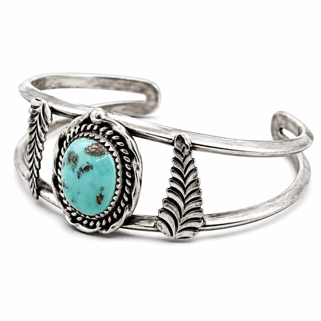 Vintage Navajo Sterling Silver & Turquoise Cuff Bracelet Signed: Vintage Navajo Sterling Silver & Turquoise Cuff Bracelet Signed 1960s-1970s, USA Vintage Navajo sterling silver cuff set with an oval turquoise cabochon in a rope-twist bezel, with applied feather ele