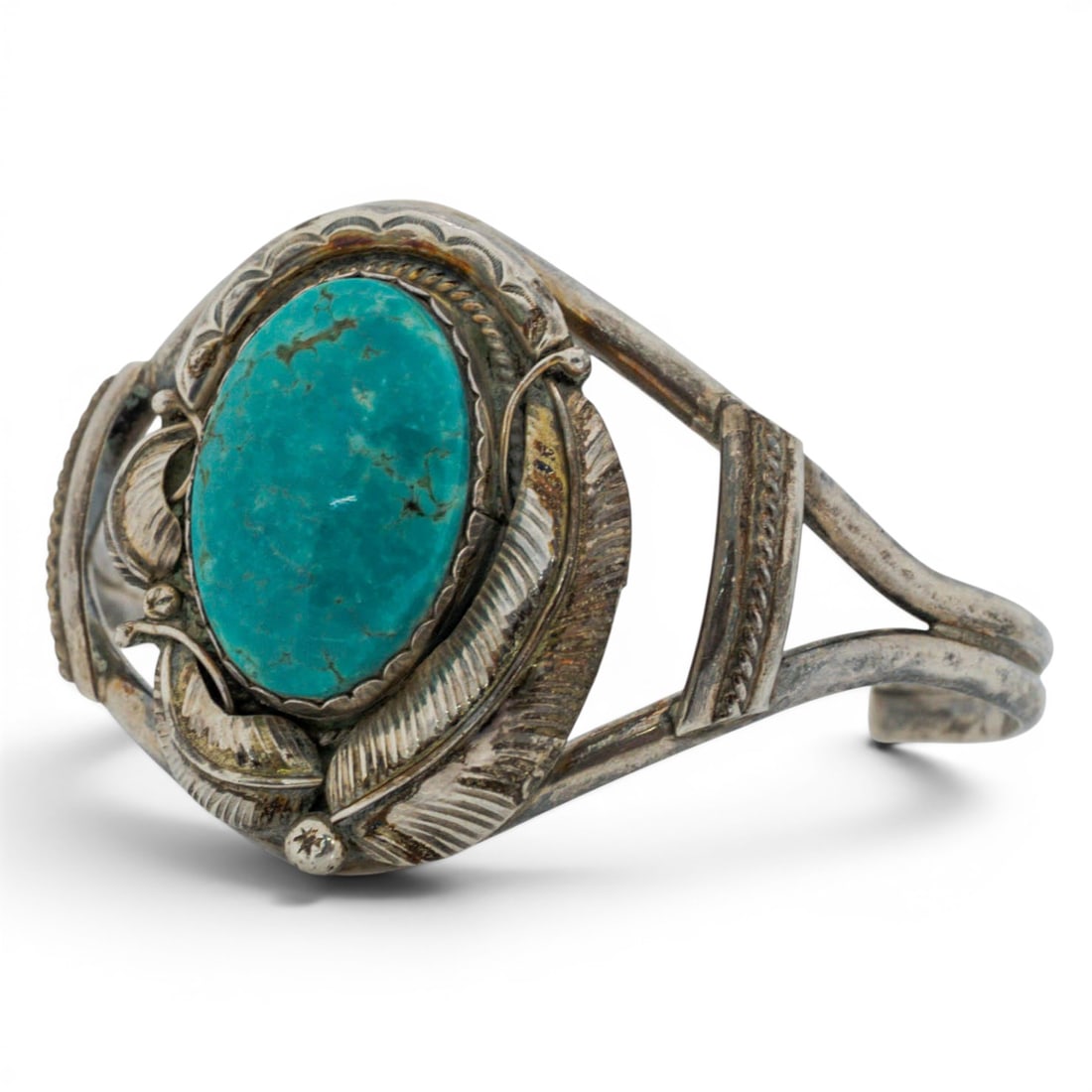 Vintage Sterling Silver & Turquoise Leaf Motif Cuff Bracelet Signed: Vintage Sterling Silver & Turquoise Leaf Motif Cuff Bracelet Signed 1970s-1980s, USA Vintage Navajo sterling silver cuff bracelet centered by a large oval turquoise cabochon in a serrated bezel, frame