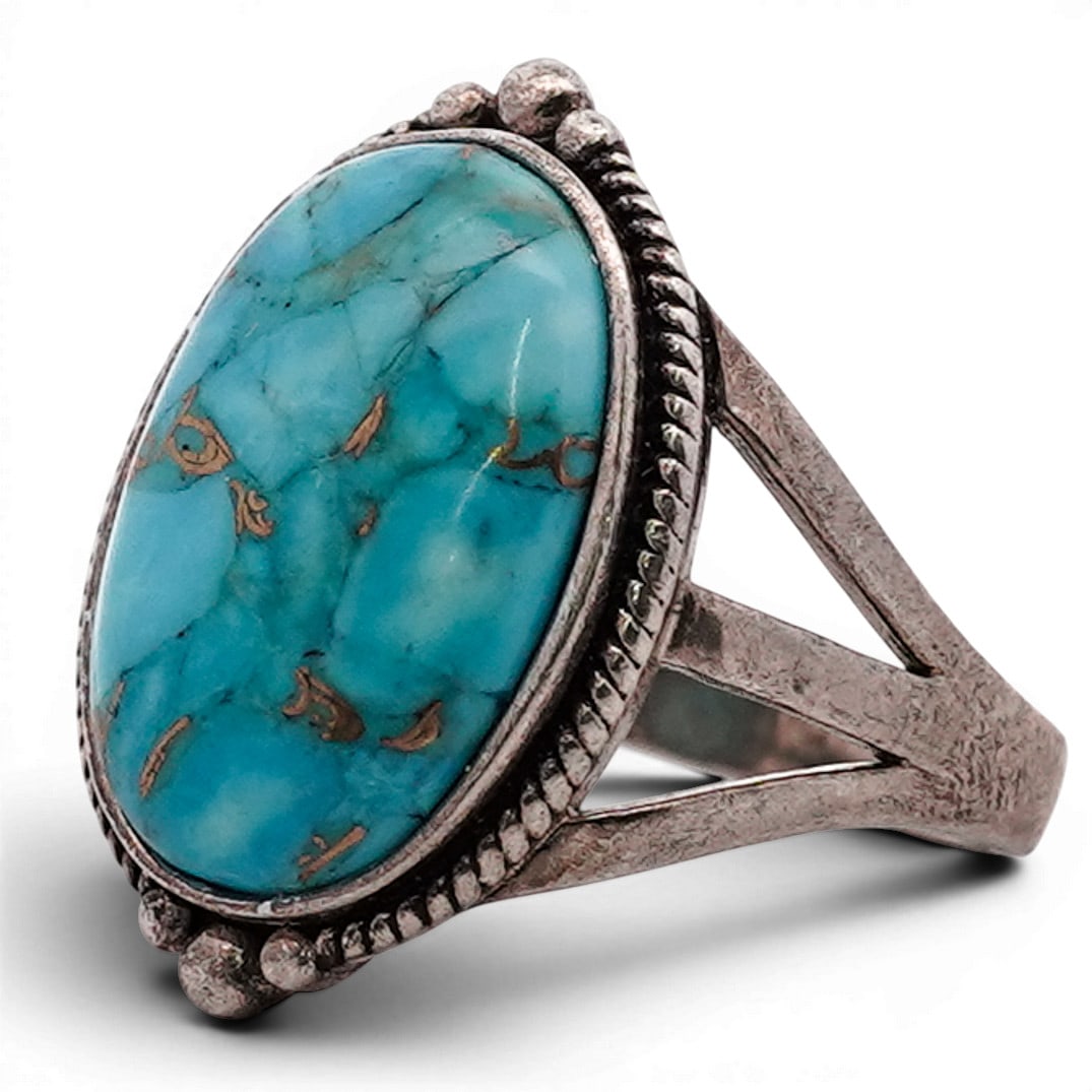 Sterling Silver Turquoise & Pyrite Matrix Ring: Sterling Silver Turquoise & Pyrite Matrix Ring Late 20th Century Southwestern style sterling silver ring set with a large oval turquoise cabochon displaying bright blue coloration with natural metalli