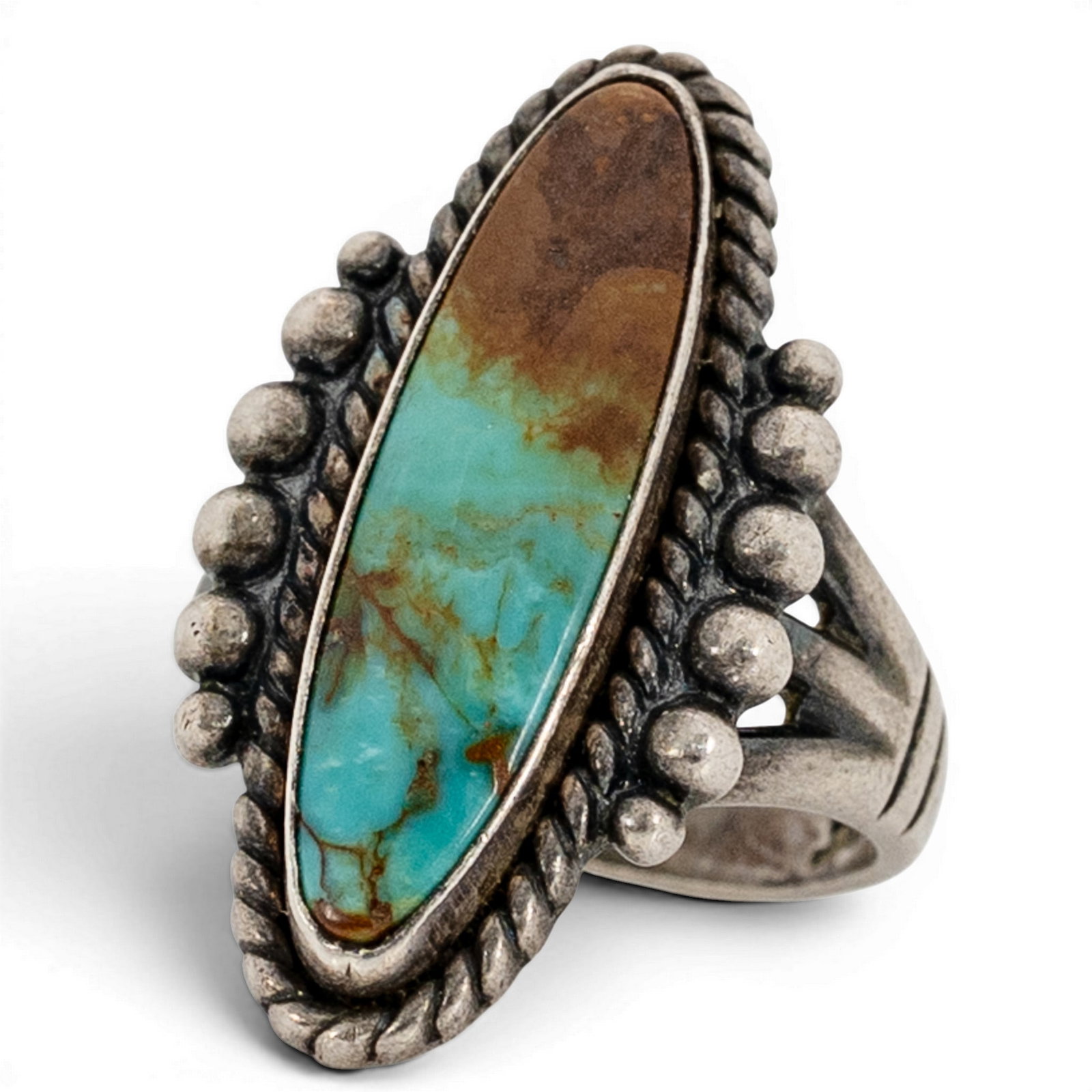 Vintage Navajo Sterling Silver & Turquoise Ring Signed: Vintage Navajo Sterling Silver & Turquoise Ring Signed 1970s-1980s, USA Elongated navette turquoise cabochon exhibiting blue-to-brown gradient with natural matrix, set in a plain bezel and framed by t