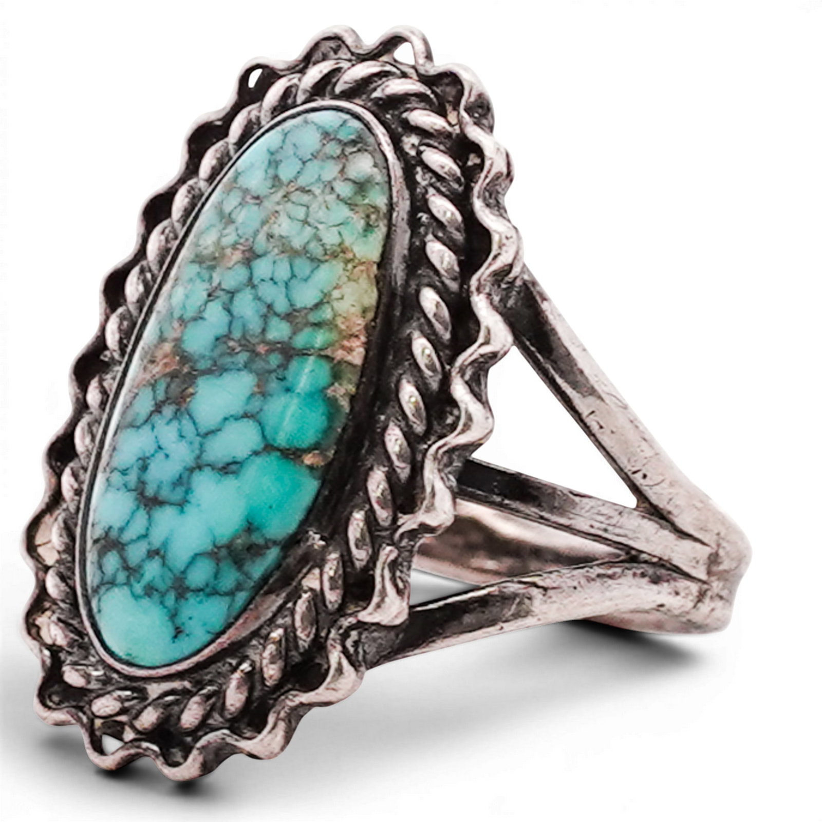 Vintage Navajo Sterling Silver & Turquoise Ring: Vintage Navajo Sterling Silver & Turquoise Ring 1970s-1980s, USA Sterling silver ring set with an elongated oval turquoise cabochon in serrated bezel, surrounded by twisted rope border and scalloped e