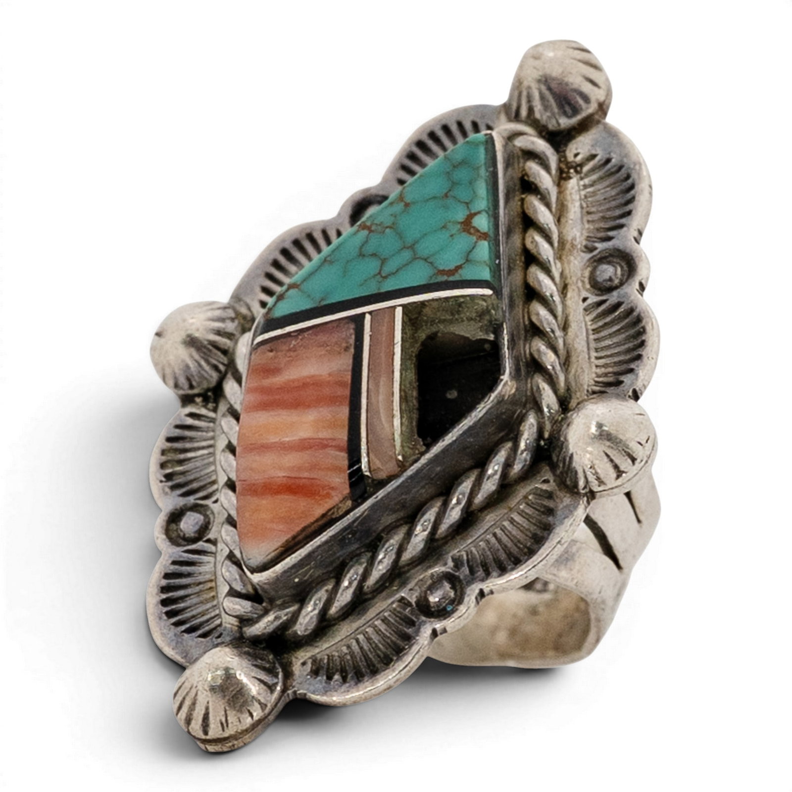 Vintage Francis Melvin Navajo Sterling Silver Inlay Ring: Vintage Francis Melvin Navajo Sterling Silver Inlay Ring 1970s-1980s, USA Shield-form ring with geometric channel inlay composed of turquoise, coral, jet, and mother-of-pearl arranged in angular segme