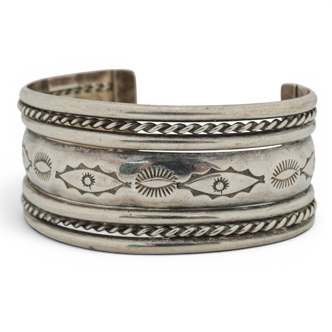 Vintage Navajo Sterling Silver Stamped & Twisted Wire Cuff Bracelet: Vintage Navajo Sterling Silver Stamped & Twisted Wire Cuff Bracelet 1970s-1980s, USA Vintage Navajo sterling silver cuff bracelet of wide band form, decorated with a continuous row of hand-stamped geo