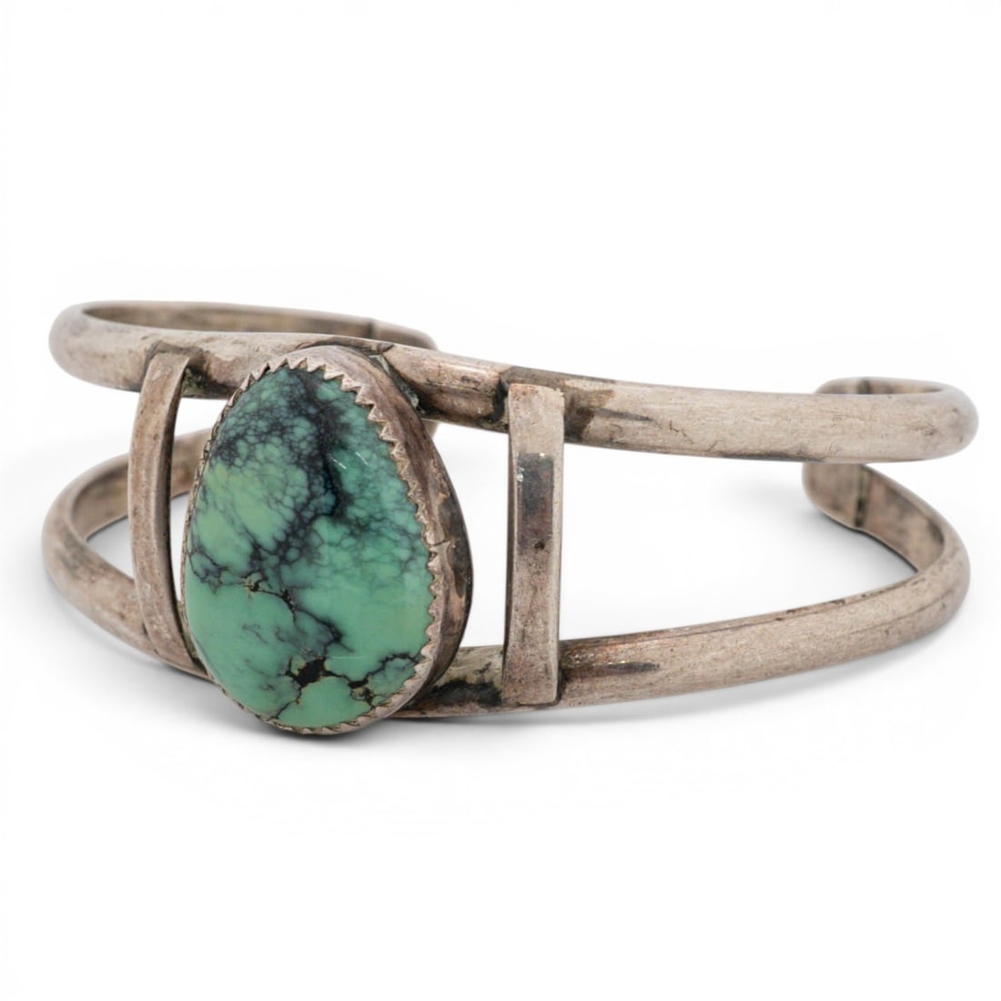 Vintage Navajo Sterling Silver & Turquoise Cuff Bracelet Signed: Vintage Navajo Sterling Silver & Turquoise Cuff Bracelet Signed 1970s-1980s, USA Sterling silver cuff bracelet set with a large oval turquoise cabochon in a serrated bezel, exhibiting green coloration