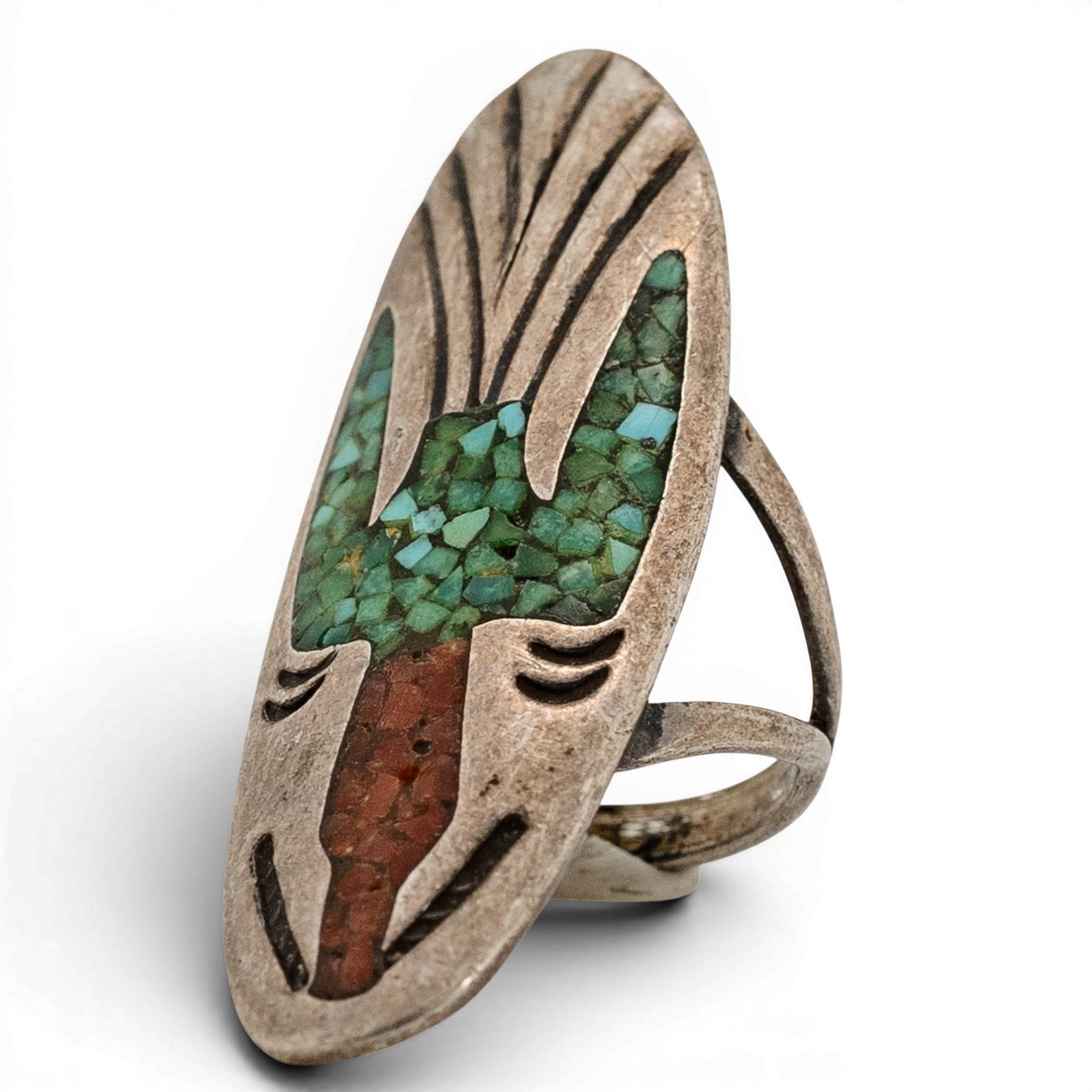 J. Nezzie Navajo Sterling Silver & Inlay Ring: J. Nezzie Navajo Sterling Silver & Inlay Ring 1980s-1990s, USA Elongated shield-form ring with stylized overlay design incorporating geometric inlay of turquoise and coral within recessed fields. Radi