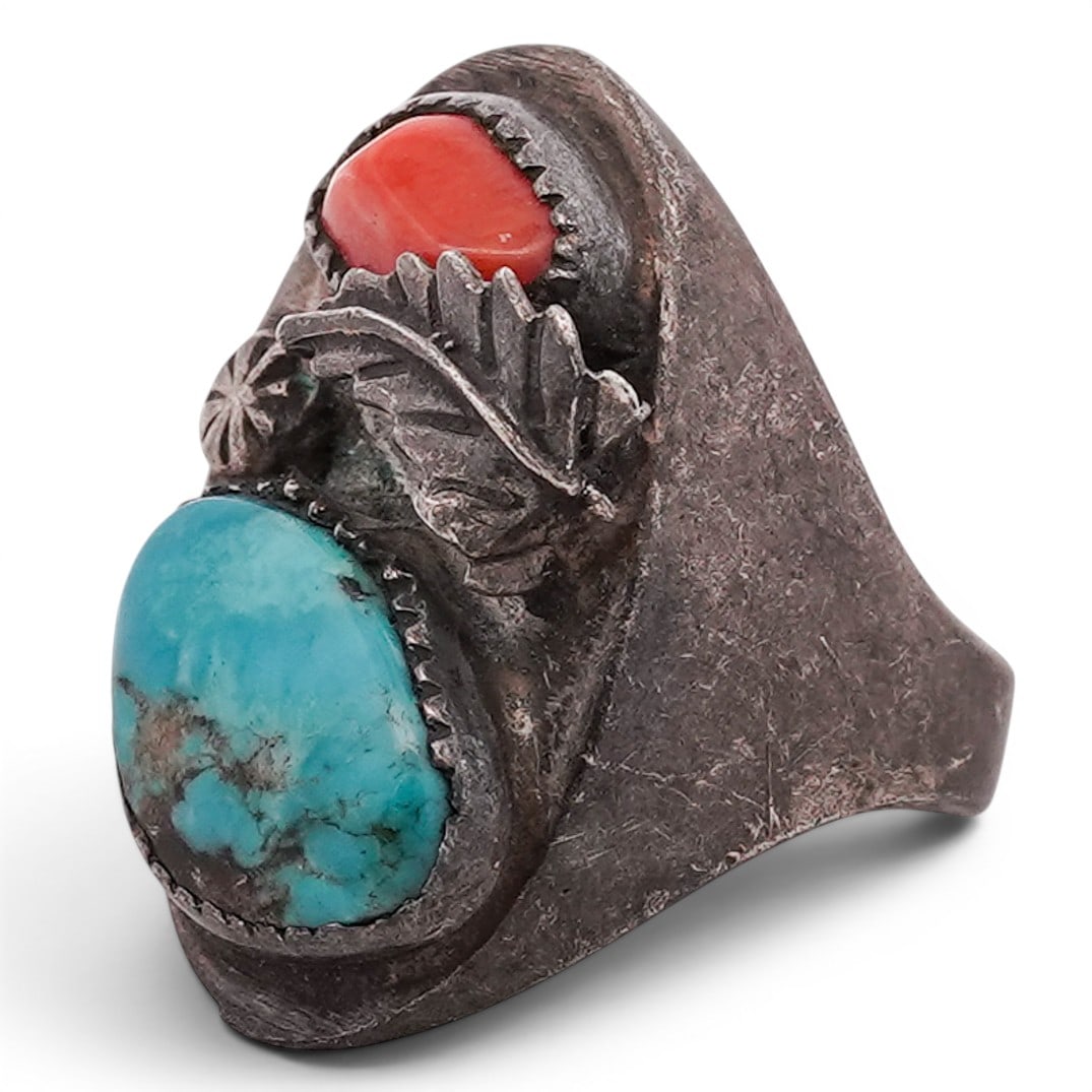 Vintage Navajo Turquoise & Coral Leaf Motif Ring Signed: Vintage Navajo Turquoise & Coral Leaf Motif Ring Signed 1970s-1980s, USA Elongated oval form ring set with a large oval turquoise cabochon above a smaller irregular coral cabochon, each in serrated be