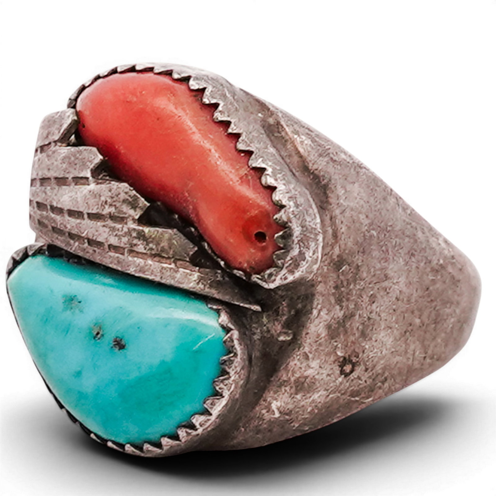 Vintage Navajo Sterling Silver Turquoise & Coral Ring: Vintage Navajo Sterling Silver Turquoise & Coral Ring 1970s–1980s, USA Sterling silver ring set with opposing turquoise and coral cabochons in serrated bezels, divided by a central applied feather-f