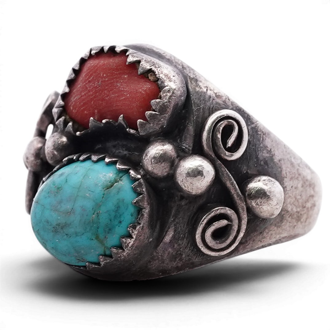 Vintage Navajo Sterling Silver Turquoise & Coral Ring: Vintage Navajo Sterling Silver Turquoise & Coral Ring Late 20th Century, USA Vintage Navajo sterling silver ring set with two cabochons, comprising a round turquoise stone of blue-green coloration wit