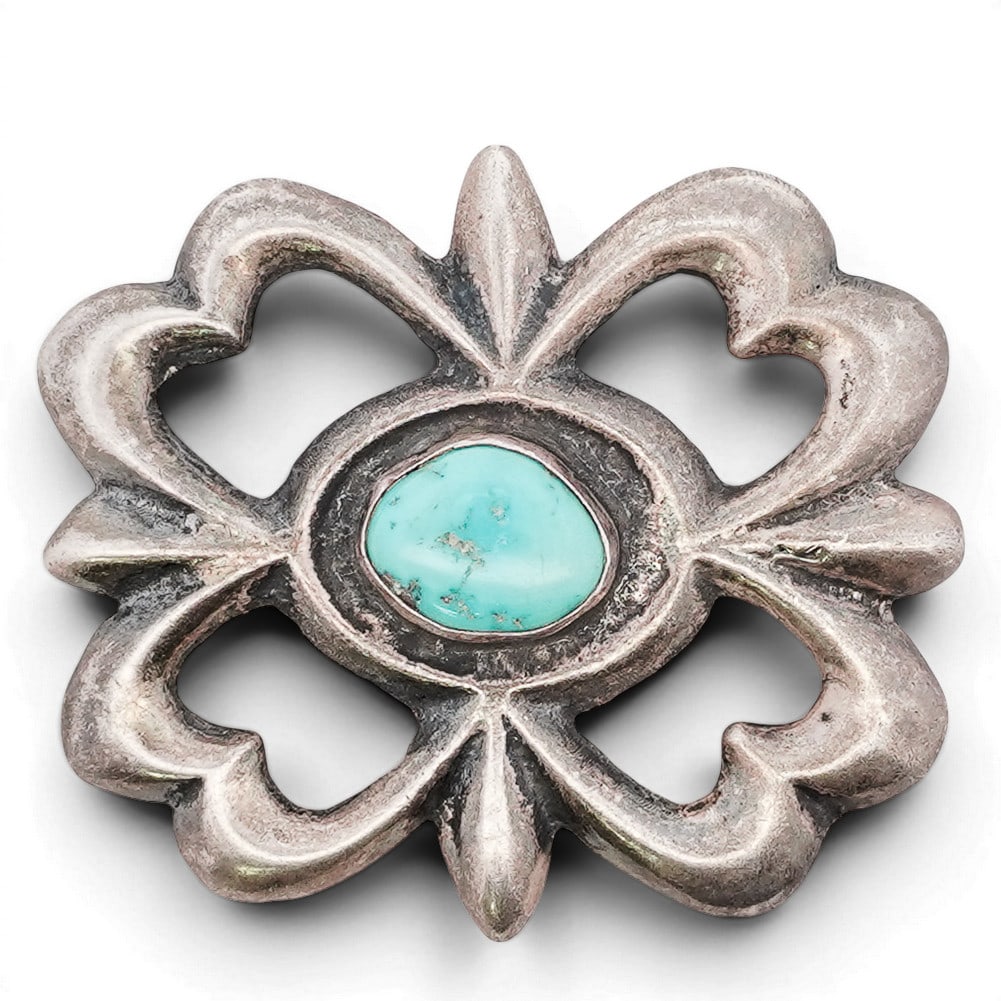 Vintage Southwestern Sterling Silver & Turquoise Belt Buckle: Vintage Southwestern Sterling Silver & Turquoise Belt Buckle 1970s-1980s, USA Sterling silver belt buckle of openwork quatrefoil form, centered with an oval blue stone cabochon in a plain bezel. The f