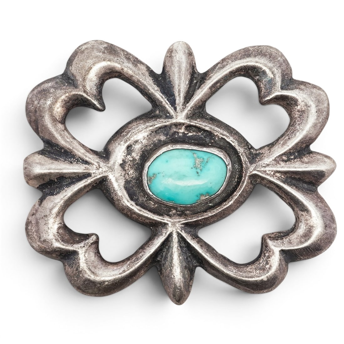 Vintage Navajo Sterling Silver & Turquoise Belt Buckle: Vintage Navajo Sterling Silver & Turquoise Belt Buckle 1960s-1970s, USA Sandcast belt buckle of radial openwork form with stylized petal and heart motifs, centered by an oval turquoise cabochon set in