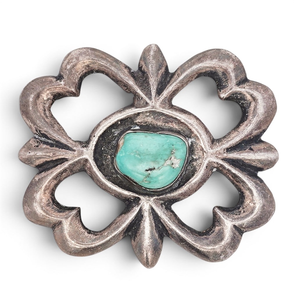 Vintage Southwestern Sterling Silver & Turquoise Belt Buckle: Vintage Southwestern Sterling Silver & Turquoise Belt Buckle 1970s-1980s, USA Cast openwork belt buckle of quatrefoil form with scalloped edges and central bezel-set turquoise cabochon. The design fea