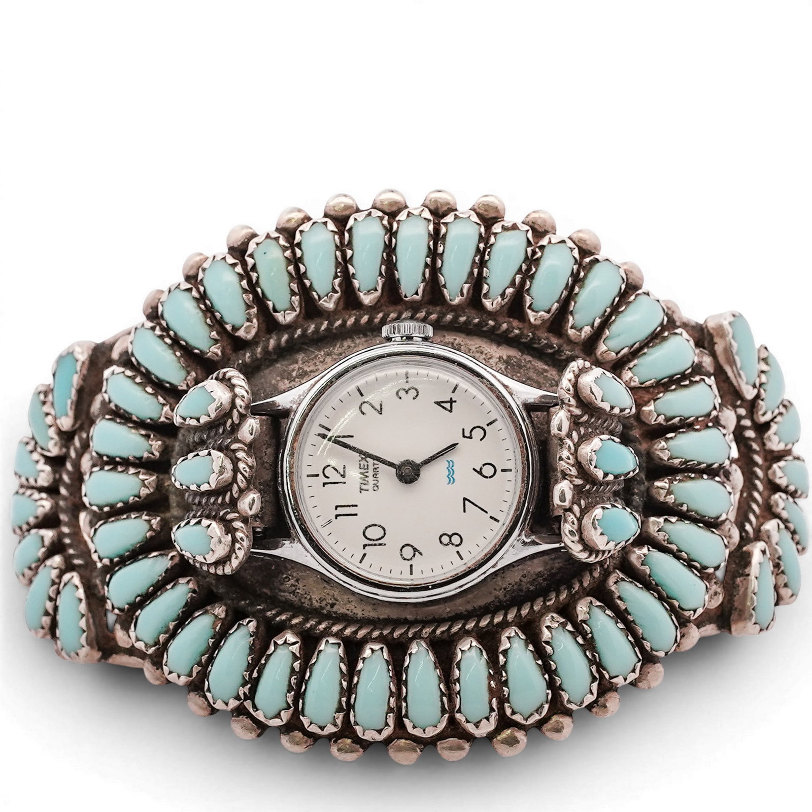 Navajo Sterling Silver & Turquoise Cluster Watch Cuff: Navajo Sterling Silver & Turquoise Cluster Watch Cuff Late 20th Century, USA Sterling silver cuff set with extensive turquoise cluster of elongated cabochons surrounding a central watch case, with rop