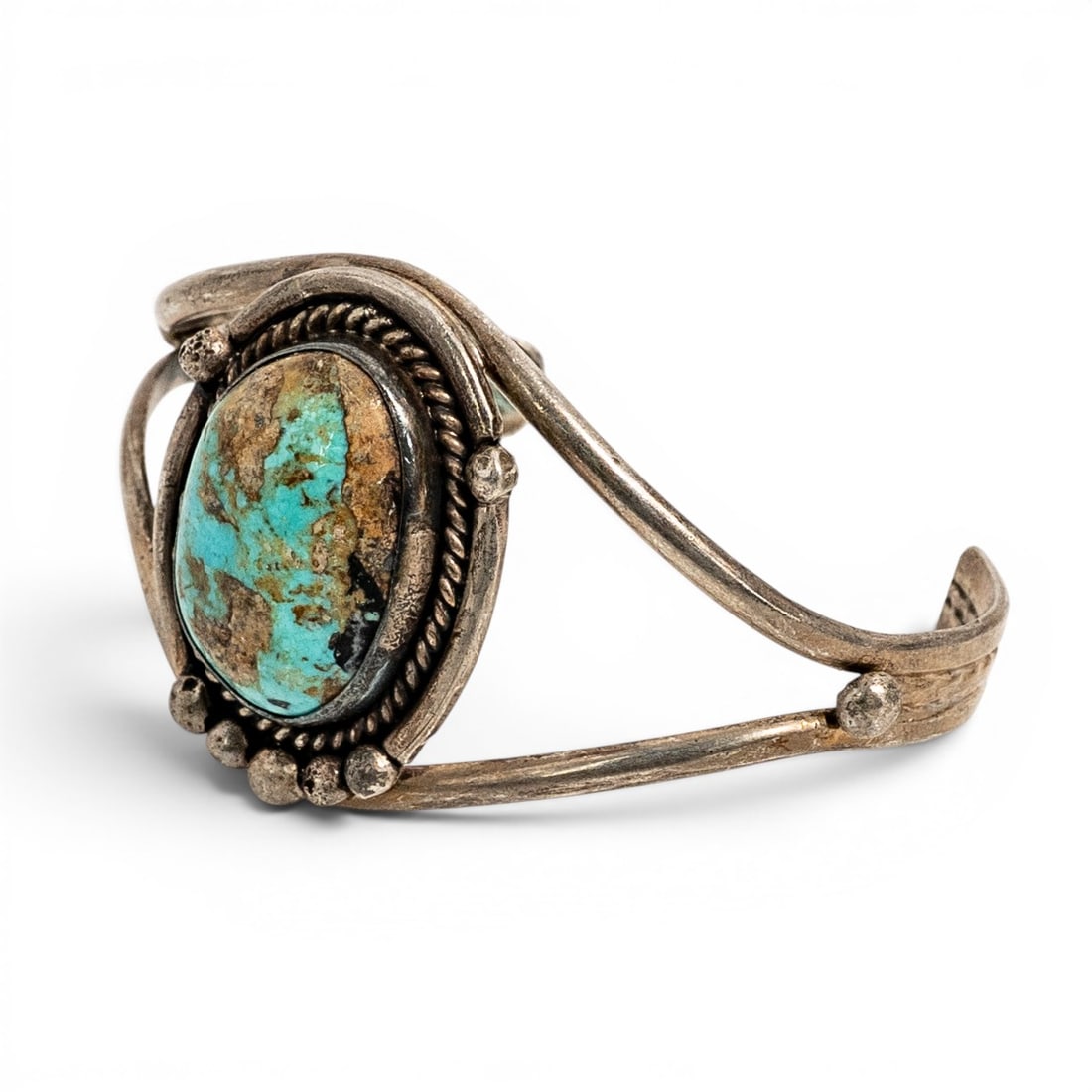 Vintage Navajo Sterling Silver & Turquoise Single Stone Cuff Bracelet: Vintage Navajo Sterling Silver & Turquoise Single Stone Cuff Bracelet 1970s-1980s, USA Hand fabricated sterling silver cuff bracelet set with a large oval turquoise cabochon displaying mixed blue-gree