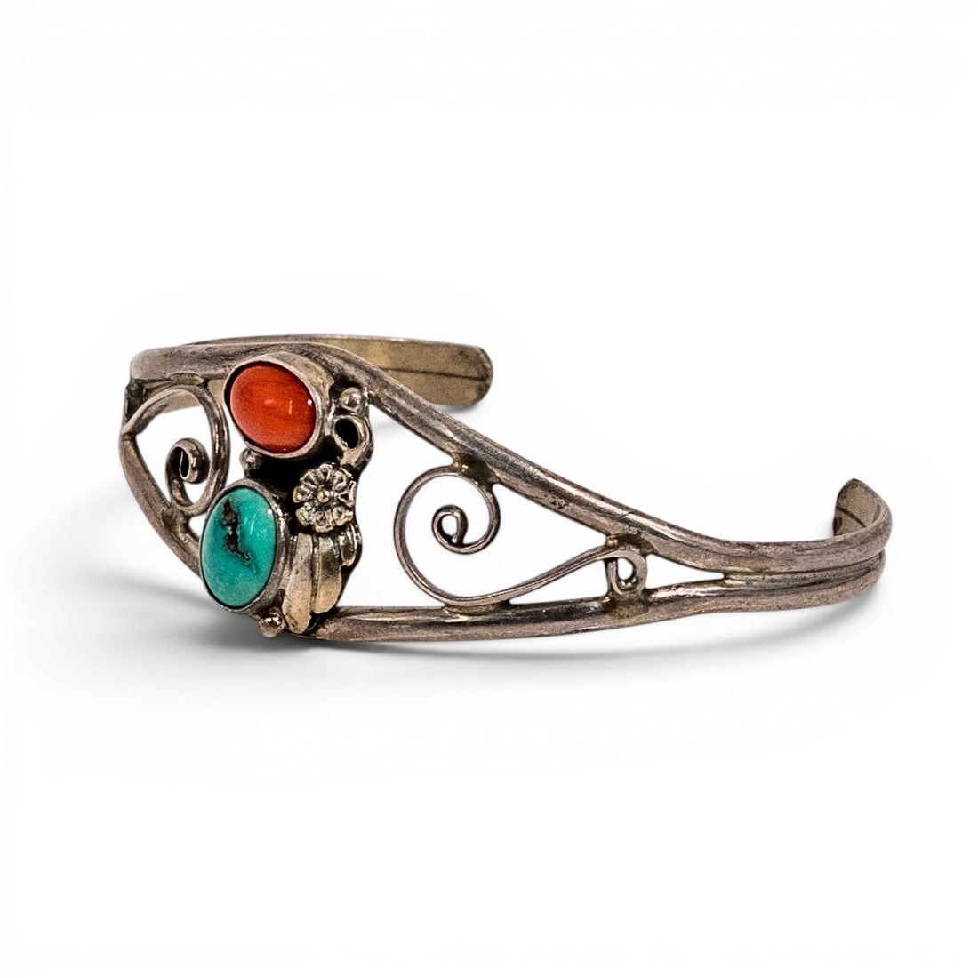 Vintage Navajo Sterling Silver Coral &Turquoise Scroll Cuff Bracelet: Vintage Navajo Sterling Silver Coral &Turquoise Scroll Cuff Bracelet 1970s, USA Hand fabricated openwork sterling silver cuff bracelet with scrolling wirework design, applied floral accent, and bezel 