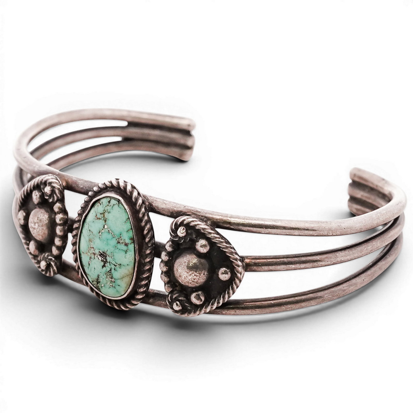 Vintage Navajo Sterling Silver & Turquoise Cuff Bracelet: Vintage Navajo Sterling Silver & Turquoise Cuff Bracelet 1970s-1980s, USA Sterling silver cuff set with three oval turquoise cabochons, each in plain bezels within scalloped stamped surrounds, on a do