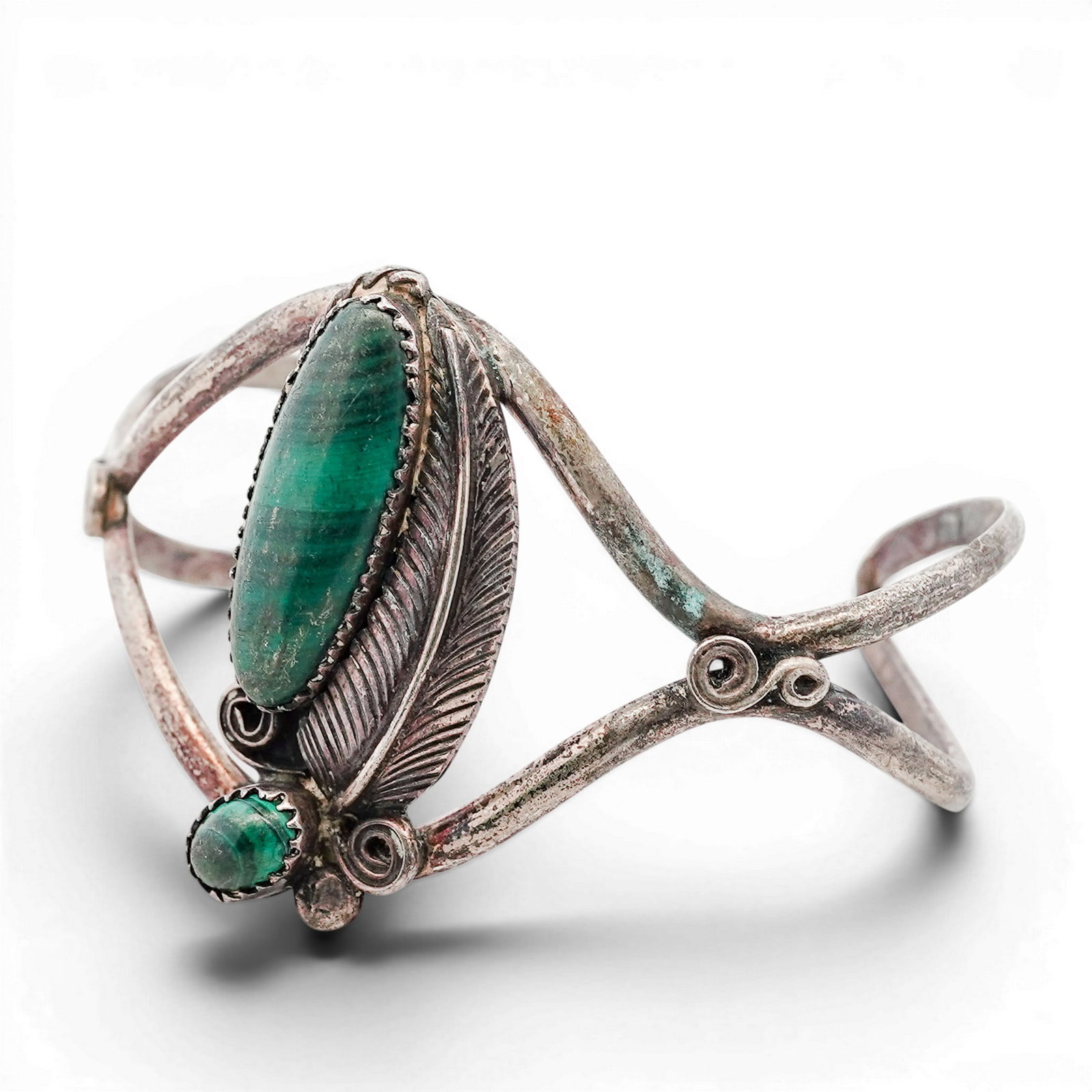 Vintage Navajo Sterling Silver & Malachite Cuff Bracelet: Vintage Navajo Sterling Silver & Malachite Cuff Bracelet 1970s-1980s, USA Hand-fabricated cuff bracelet featuring two malachite cabochons set in serrated bezels, framed by twisted wire and applied scr