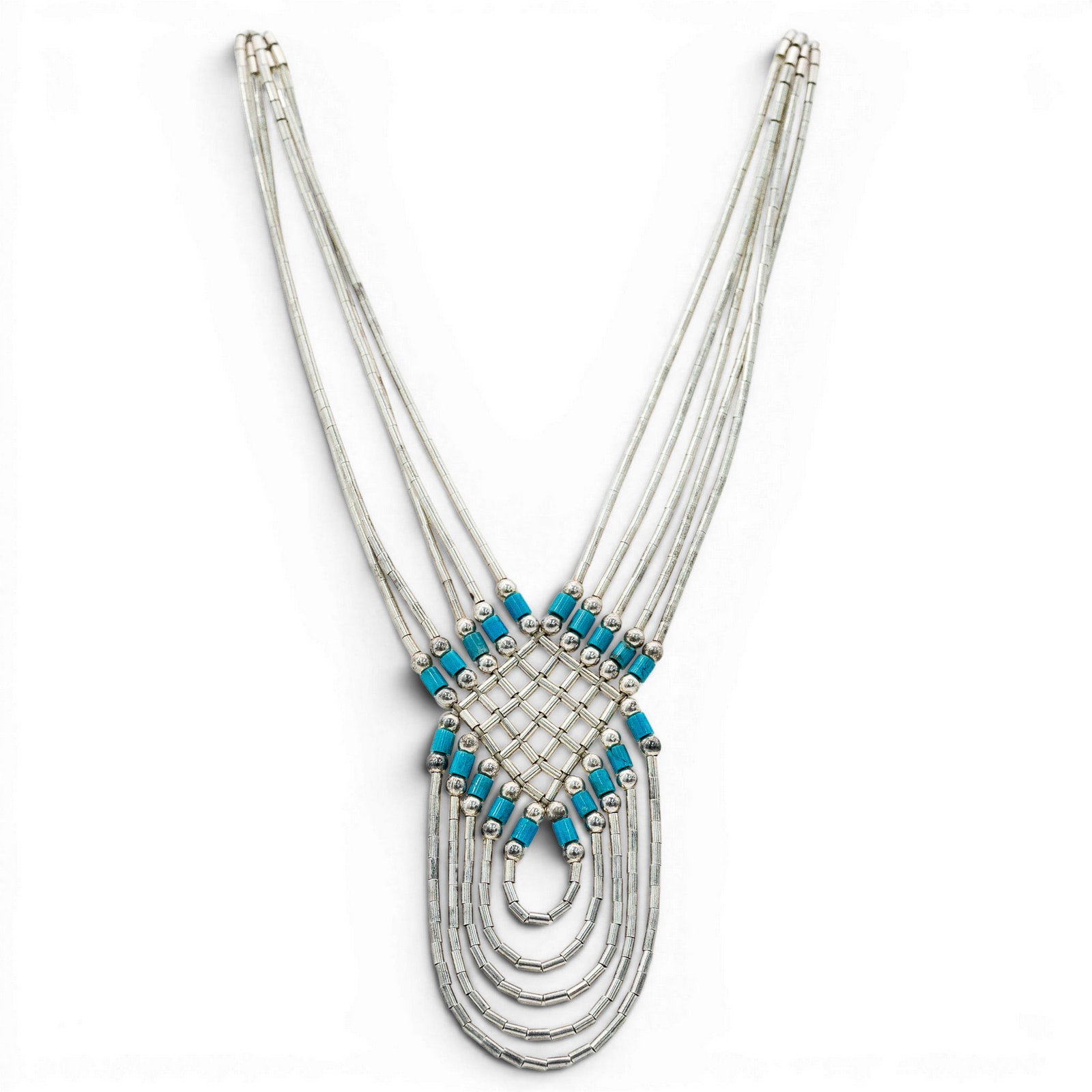 Vintage Navajo Sterling Silver & Turquoise Heishi Necklace: Vintage Navajo Sterling Silver & Turquoise Heishi Necklace 1970s-1980s, USA Multi strand sterling silver necklace comprised of tubular silver heishi beads with woven central lattice panel accented by 