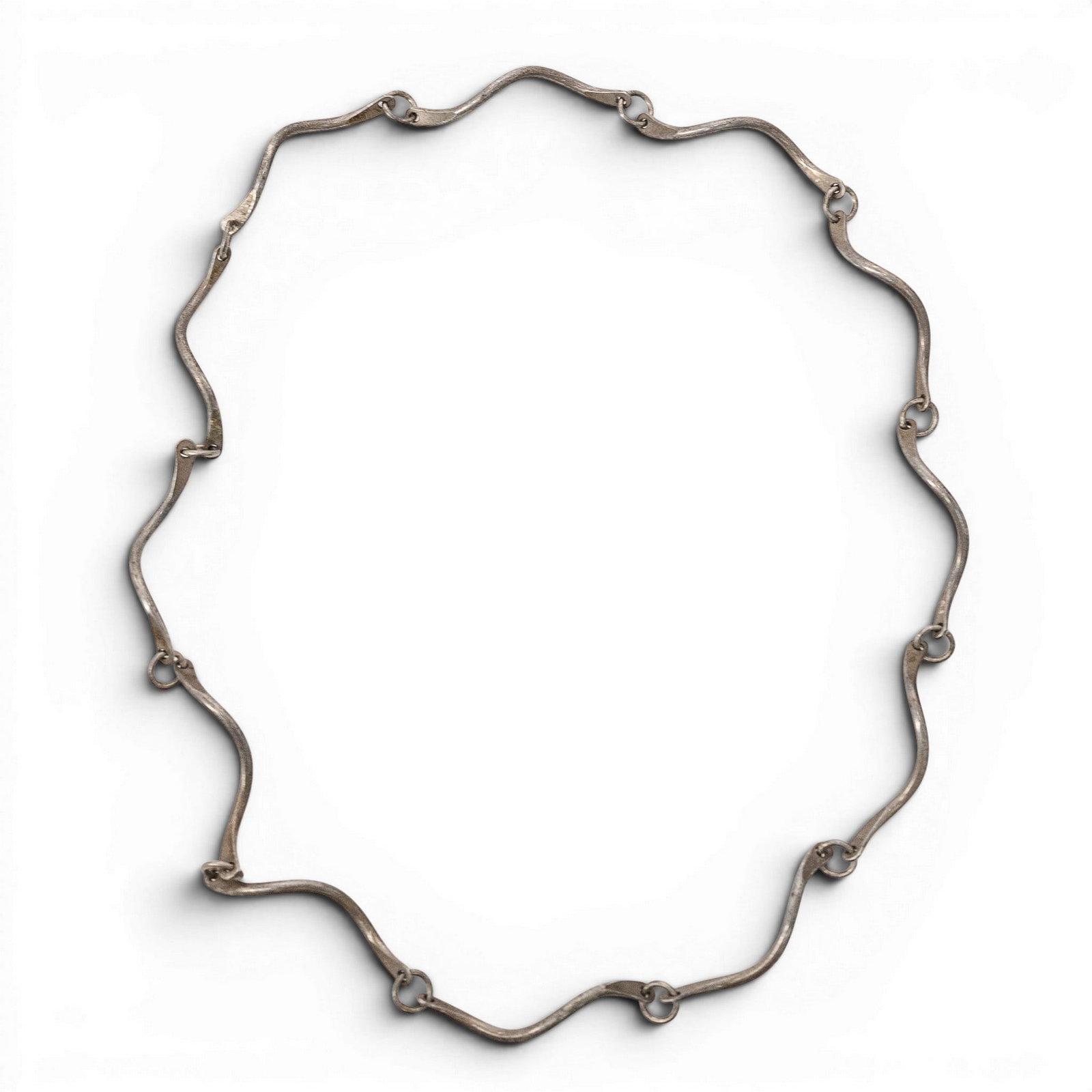 Vintage Sterling Silver Sculptural Link Modernist Necklace: Vintage Sterling Silver Sculptural Link Modernist Necklace 1970s-1980s, USA Vintage Sterling silver necklace composed of elongated hand-formed wavy open links joined by circular connector rings, with 